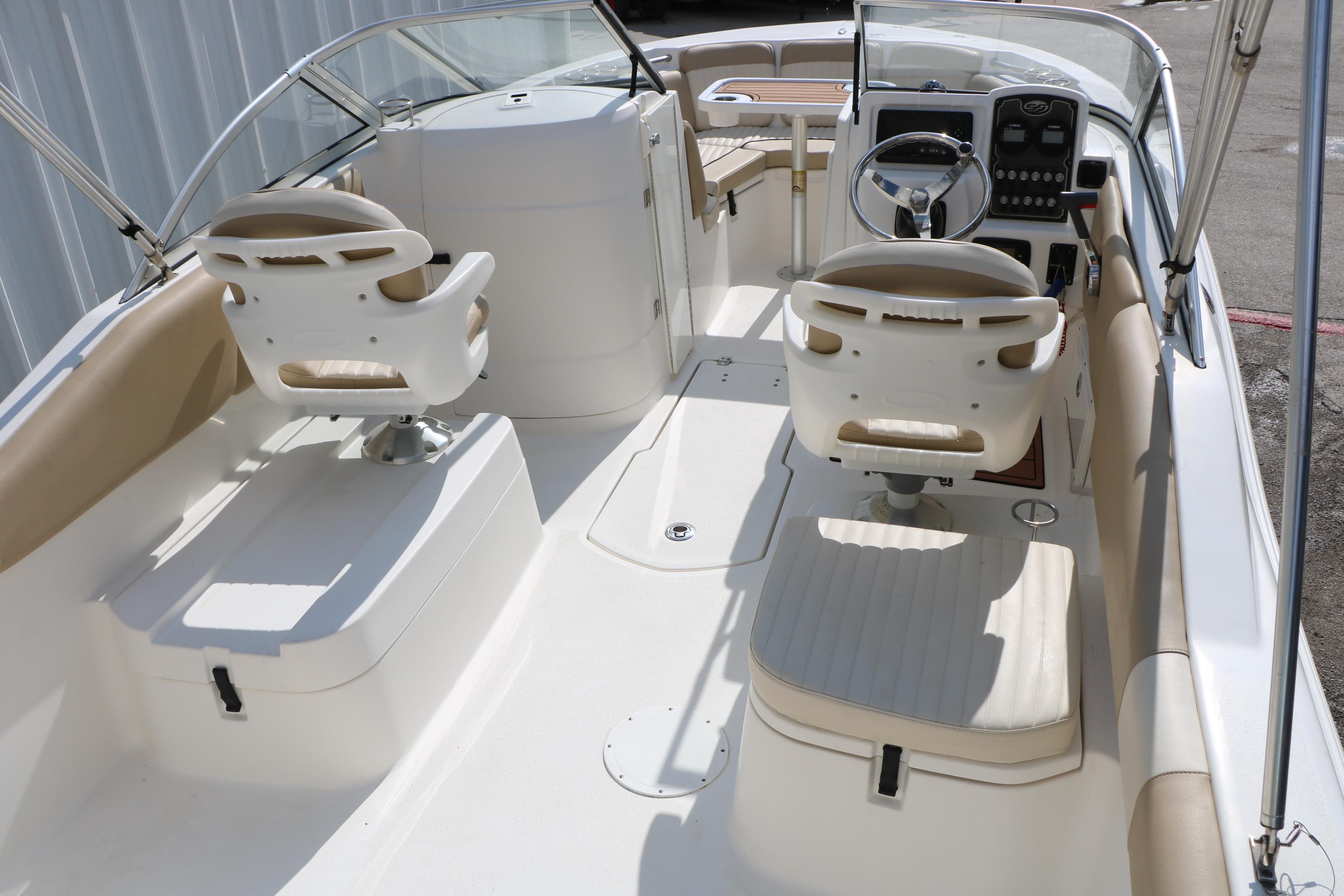 2017 Sea Fox 226 Traveler boat interior with dual captain chairs and steering console.