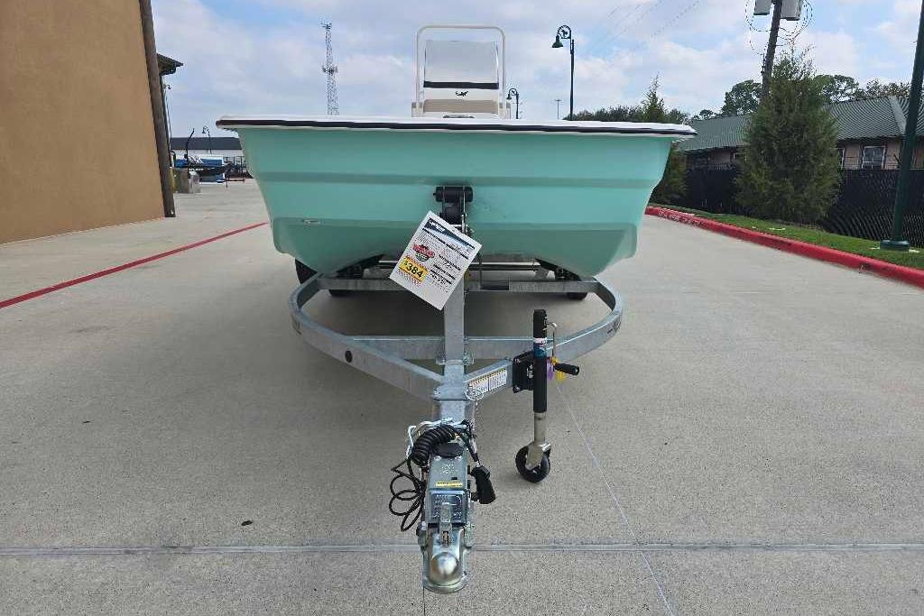 2026 Mako Pro Skiff 19 CC boat on trailer, parked outdoors.