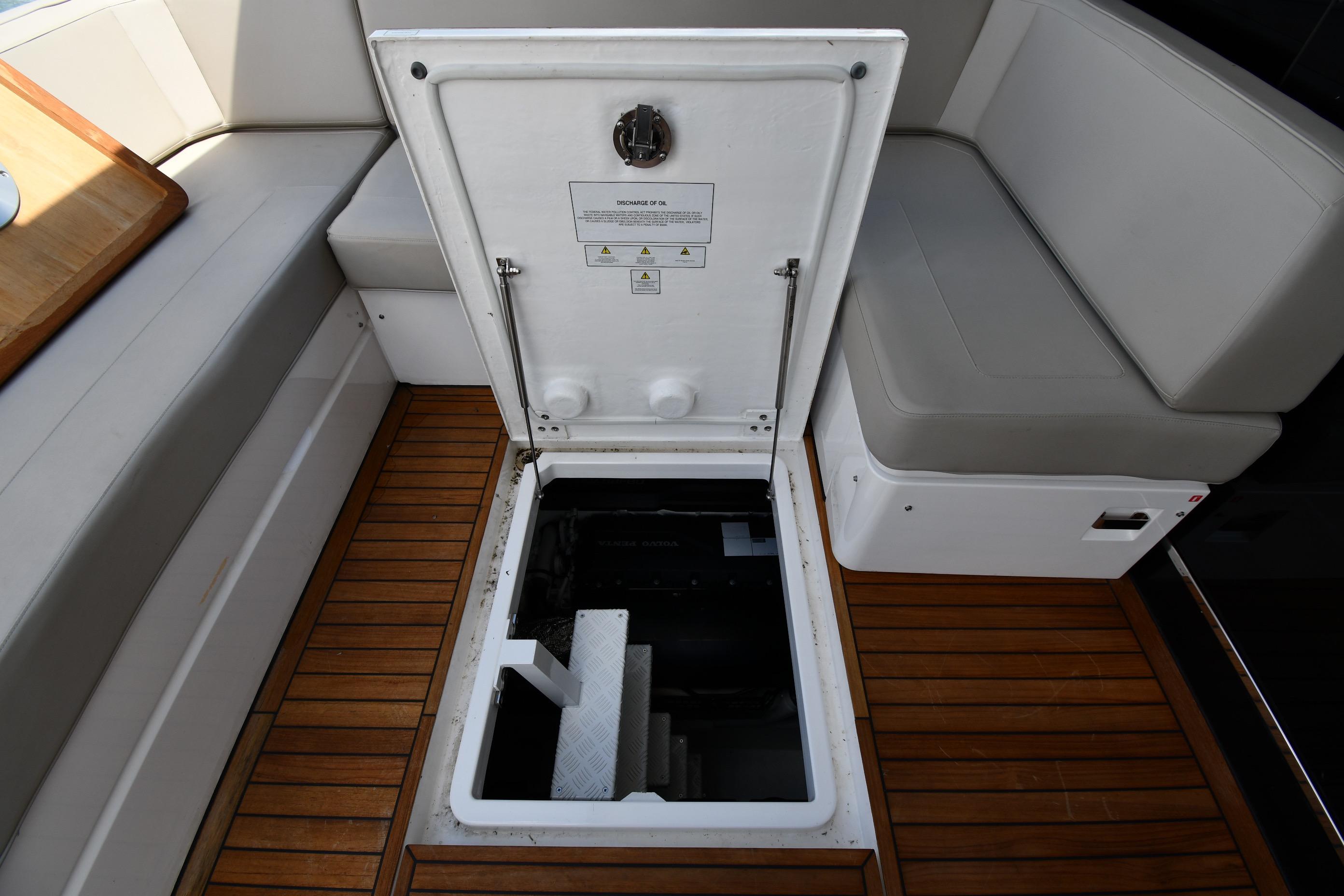 Open hatch on 2024 Fairline G50 Targa yacht, revealing engine compartment.