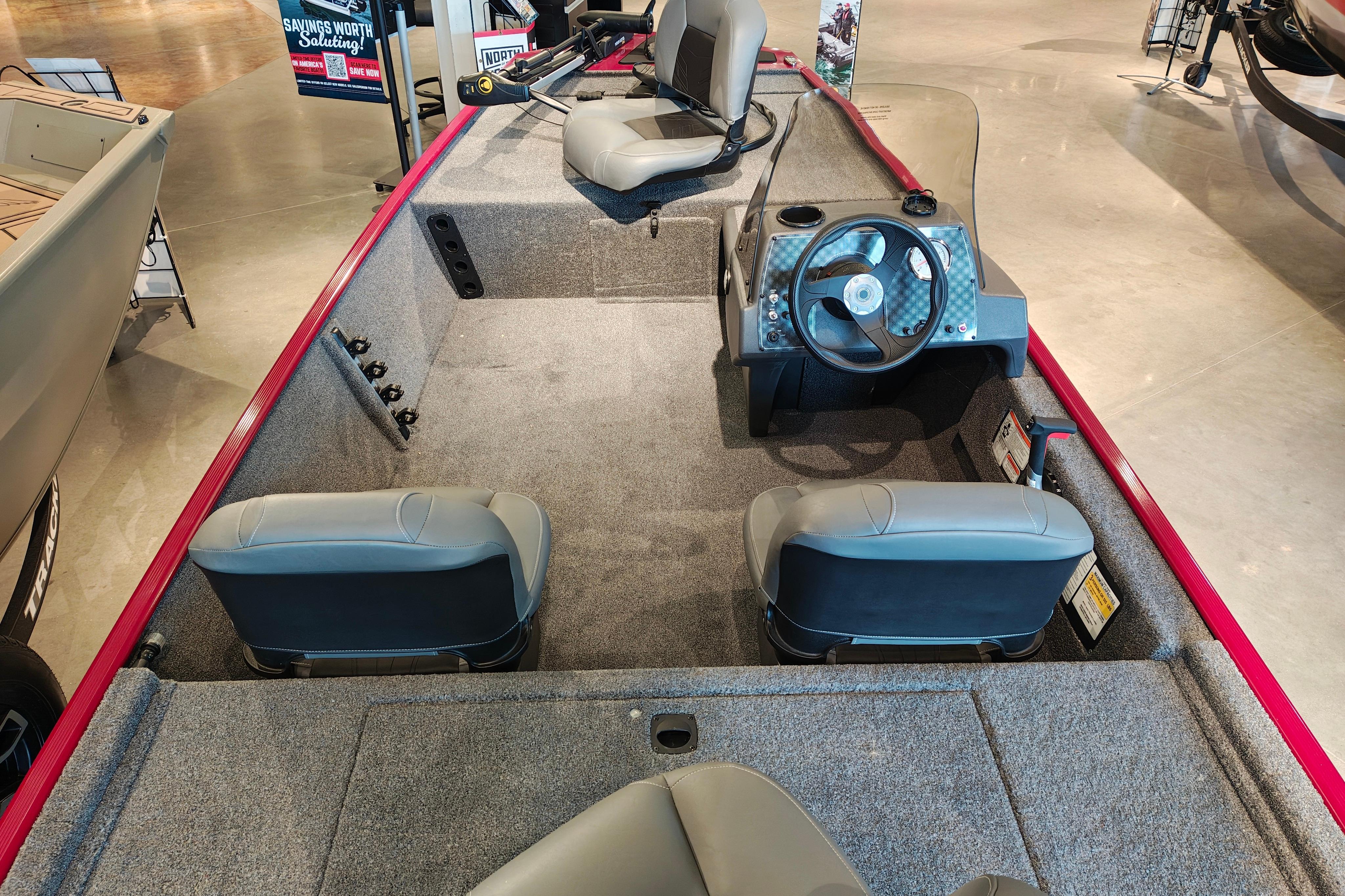 Interior view of 2026 Tracker Bass Tracker Classic XL boat with seating and steering console.