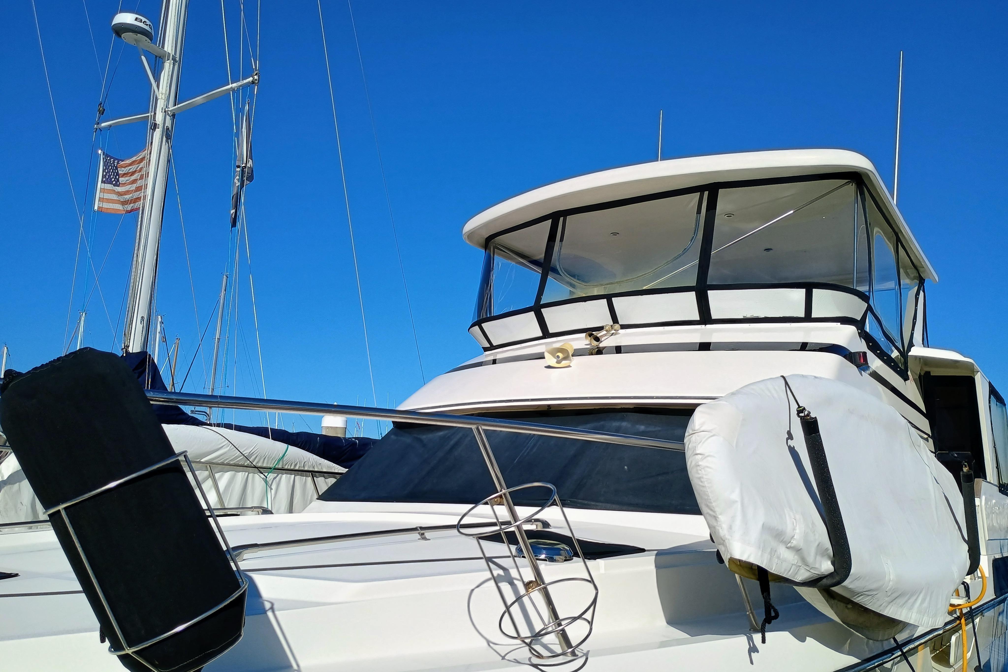 1988 Vantare 46' Aft Cabin Wide Body MY yacht docked under clear blue sky.