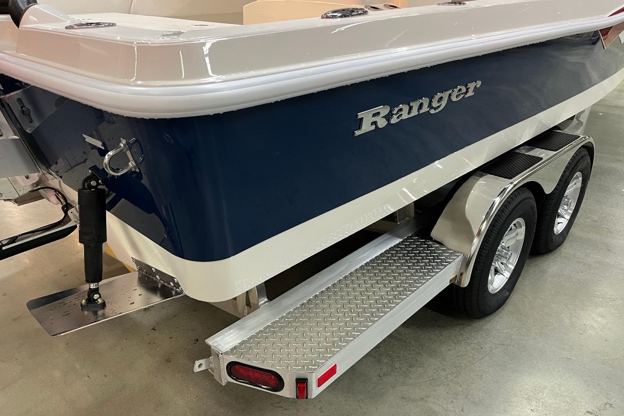 2026 Ranger 2510 Bay boat on trailer, featuring a sleek blue and white design.