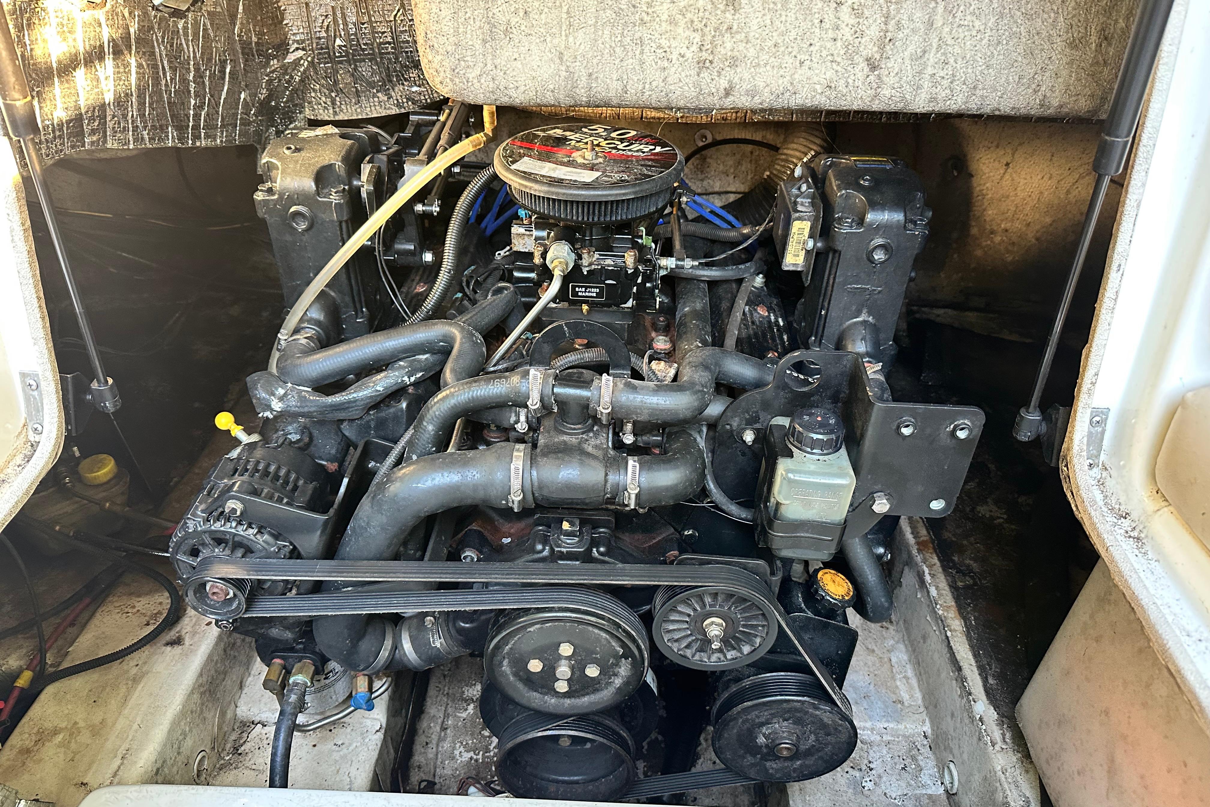 Engine compartment of a 2008 NauticStar 230 SL Sport Deck I/O boat.