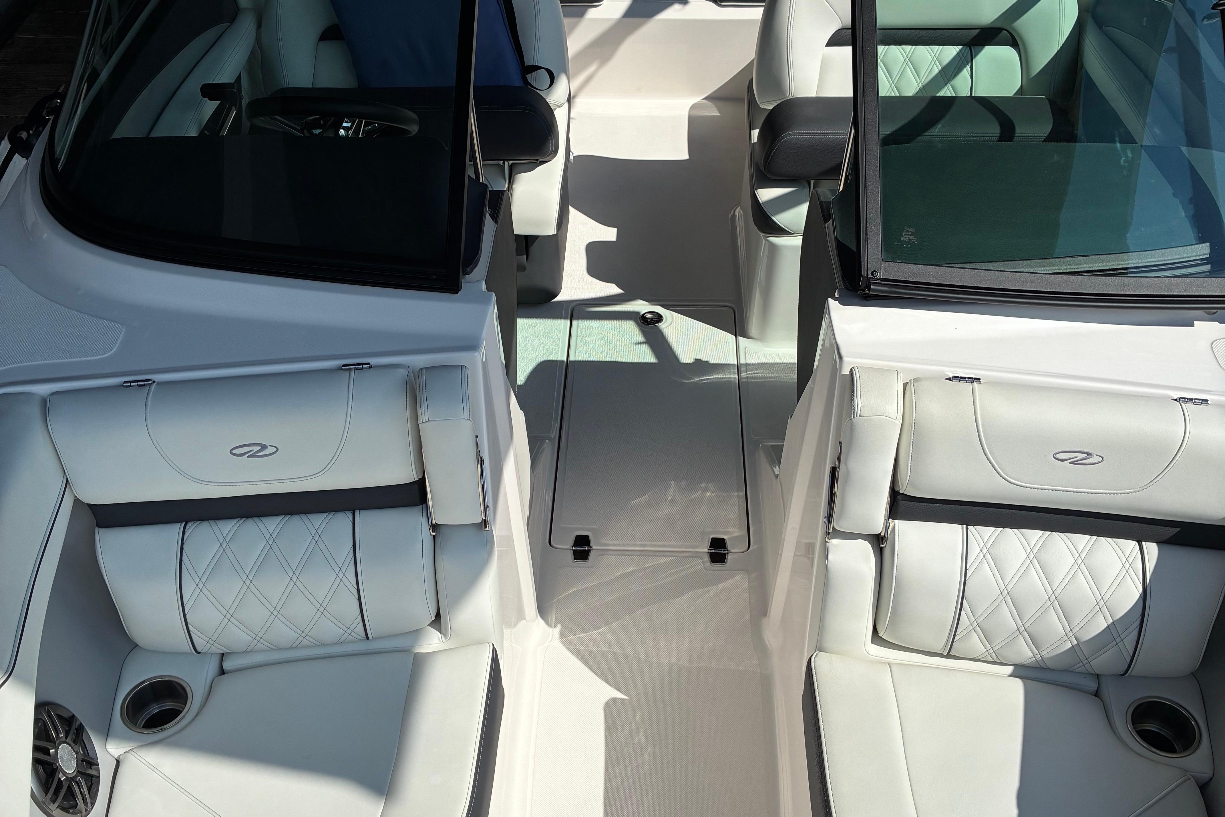 2025 Regal LS2 boat interior with white leather seating and cup holders.