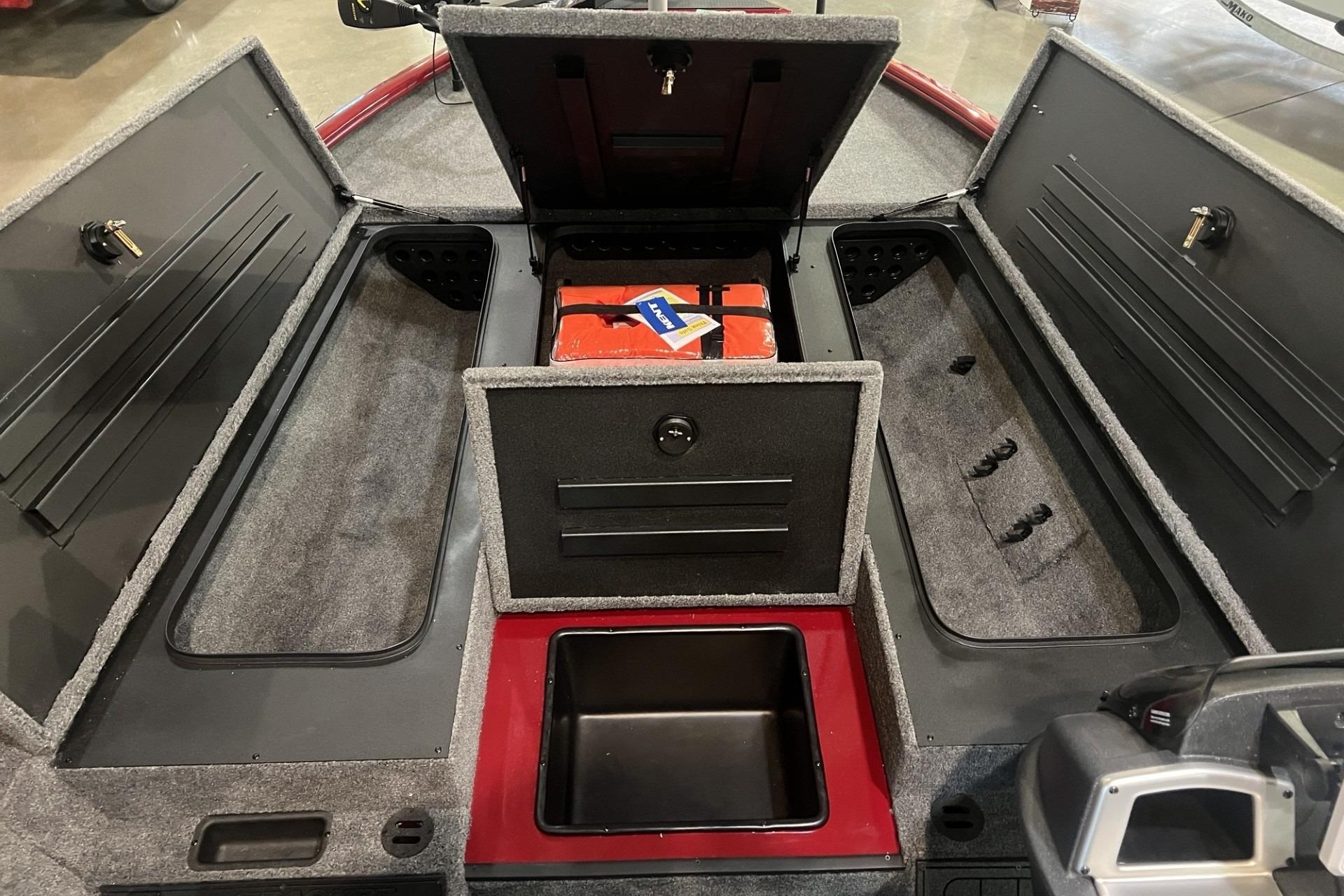 2025 Tracker Savage 215 boat interior with open storage compartments and safety equipment.