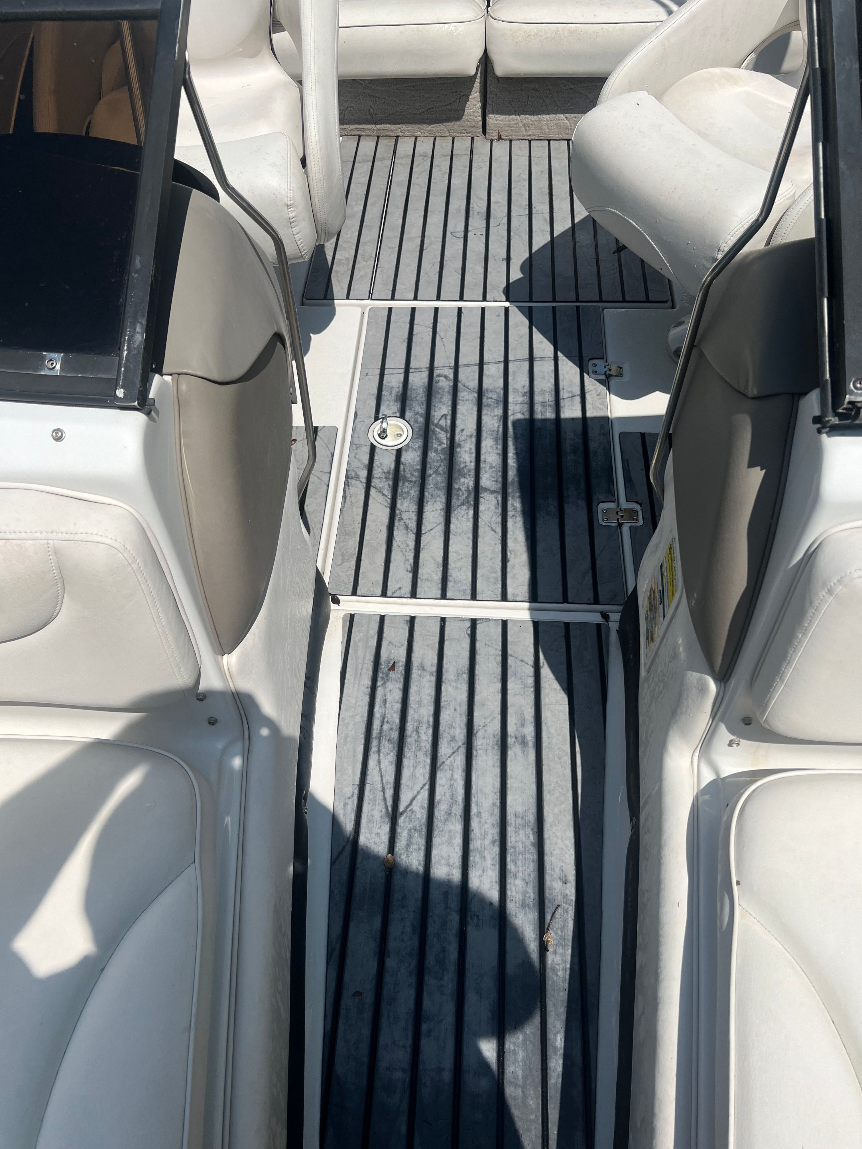 Interior of a 2001 Crownline 202 BR boat with gray flooring.