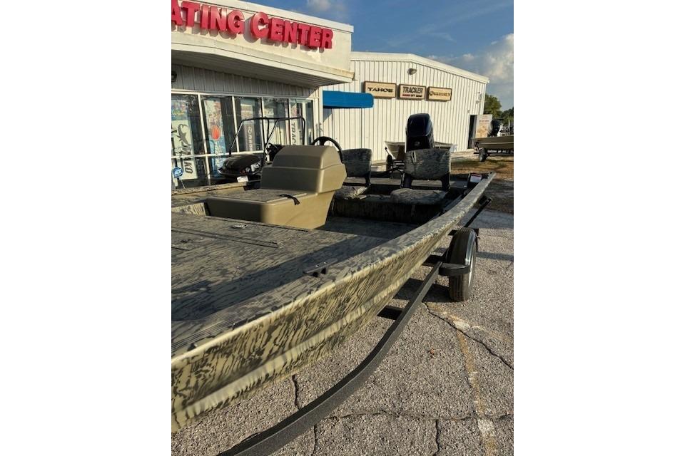 2026 Tracker Grizzly 1754 SC boat displayed outside a boating center.