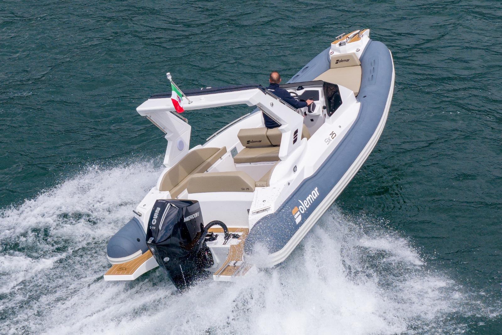 2026 Solemar SX25 boat cruising on water with powerful engine and sleek design.