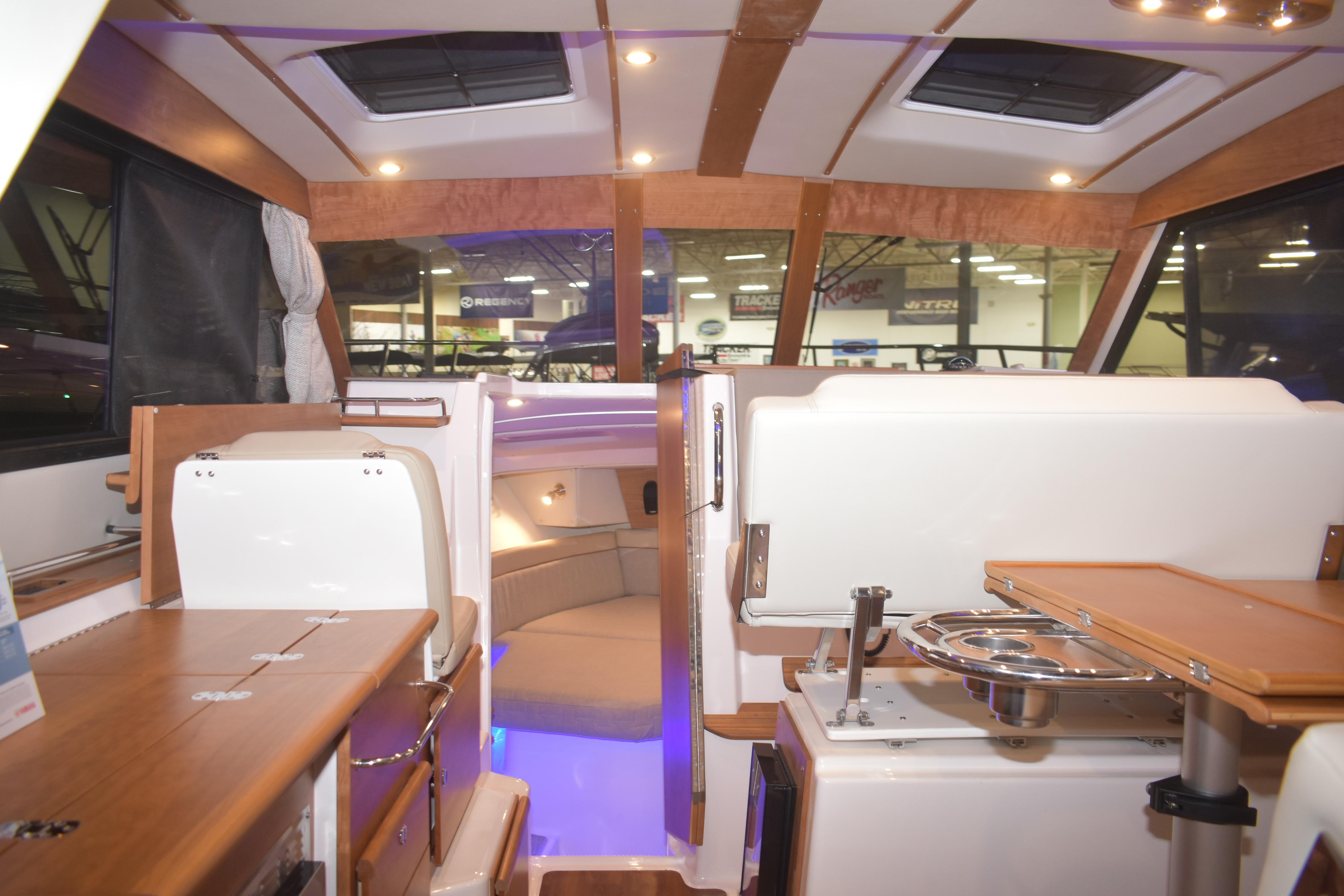 Interior of 2026 Cutwater C-32 CB boat with modern seating and lighting.