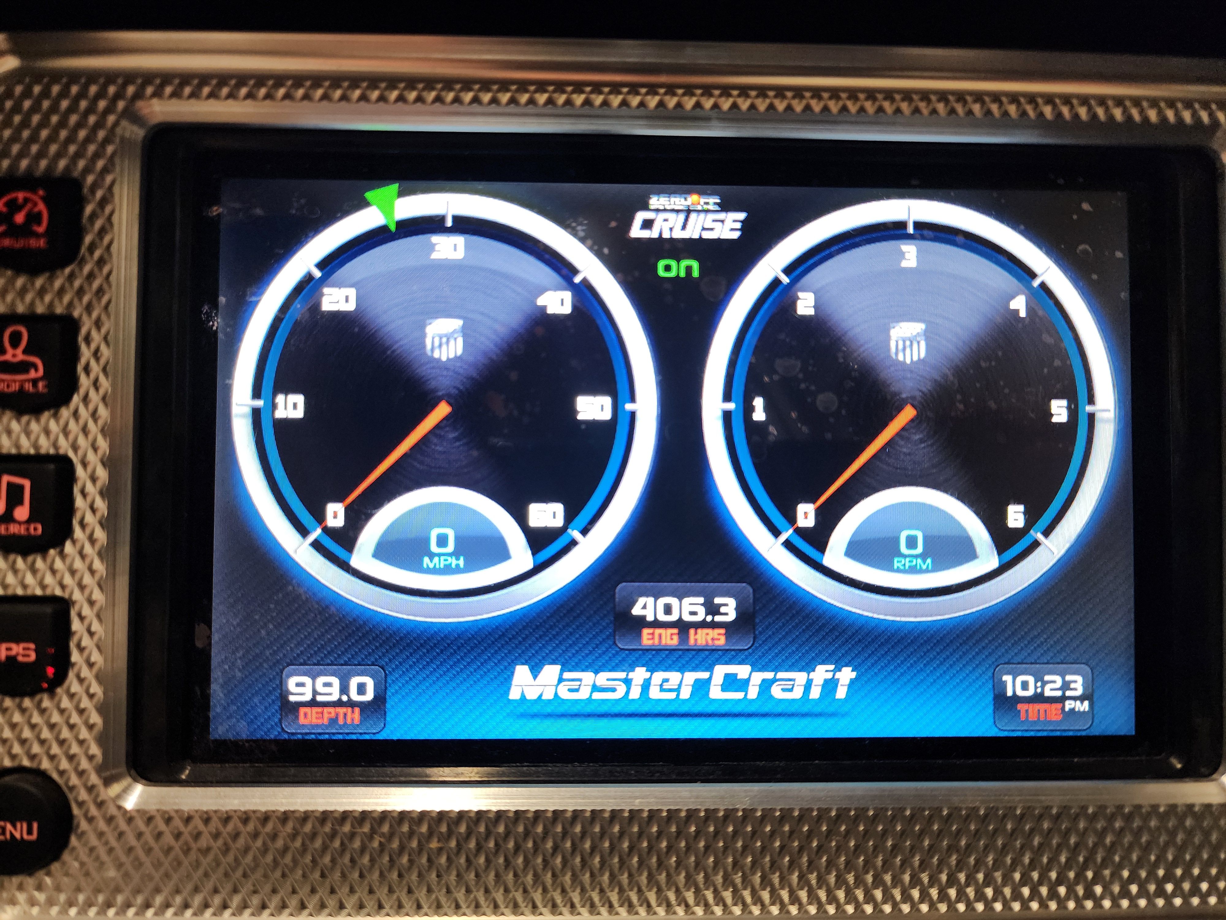 2013 MasterCraft XStar dashboard displaying speed and RPM gauges.