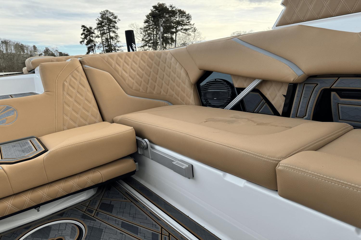 2024 Tigé RZX22 boat interior with tan leather seats and diamond stitching.