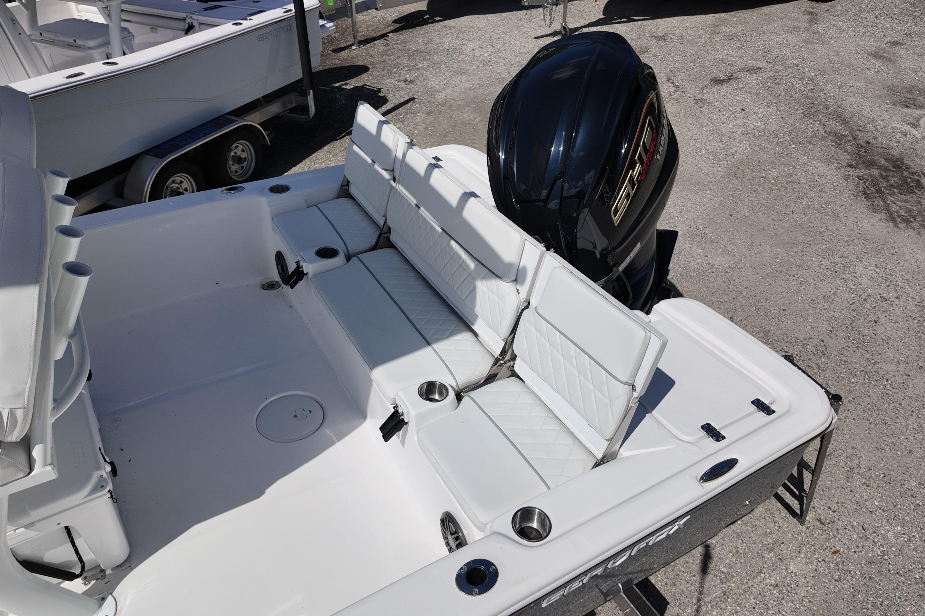 2026 Sea Fox 251 Bay Fox boat with white seating and powerful outboard motor.