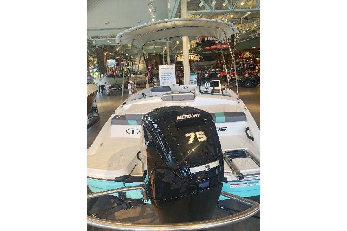 2026 Tahoe T16 boat with Mercury 75 engine displayed indoors.