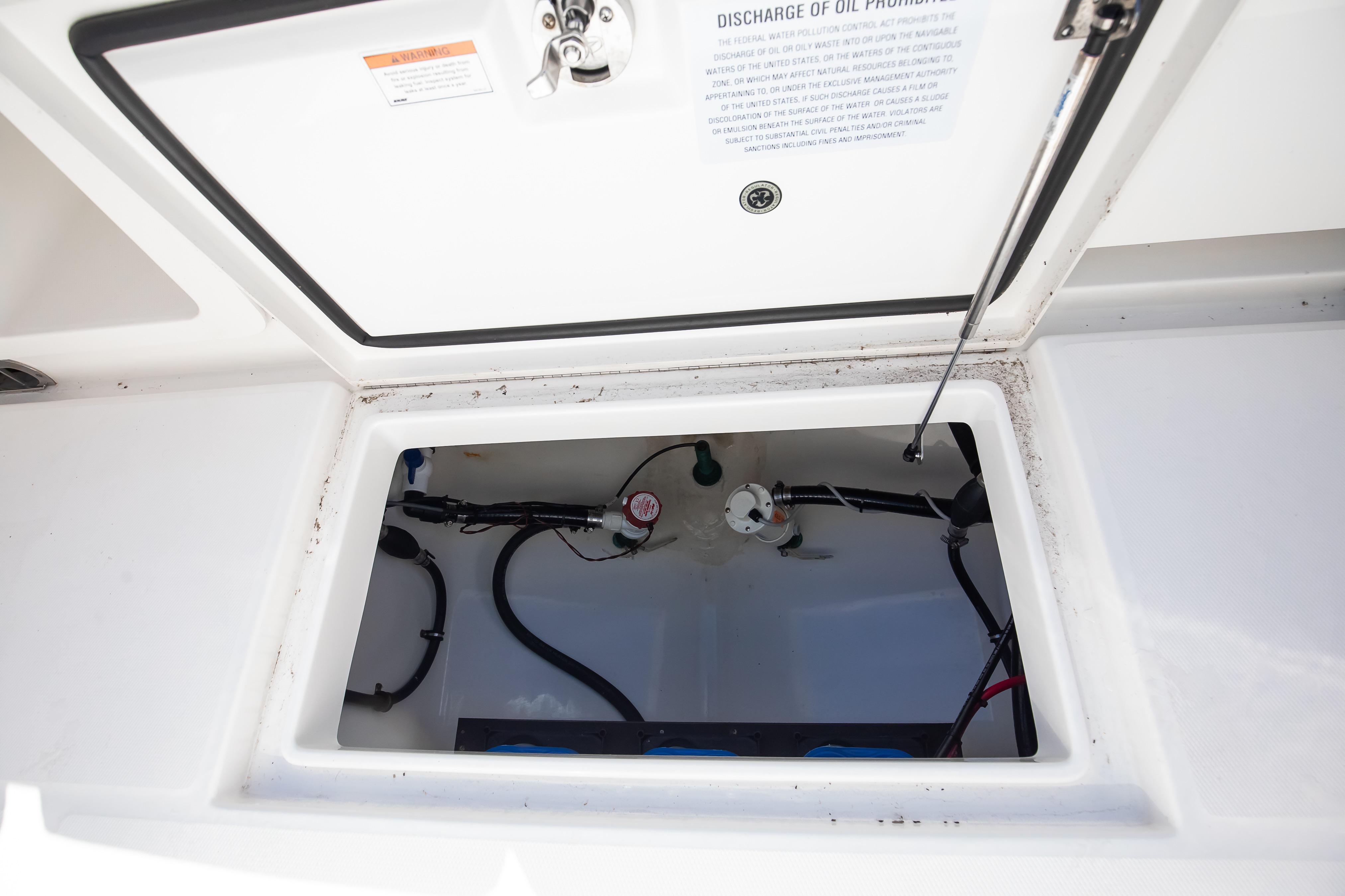Open storage compartment on 2022 Regulator 28 Forward Seating boat.