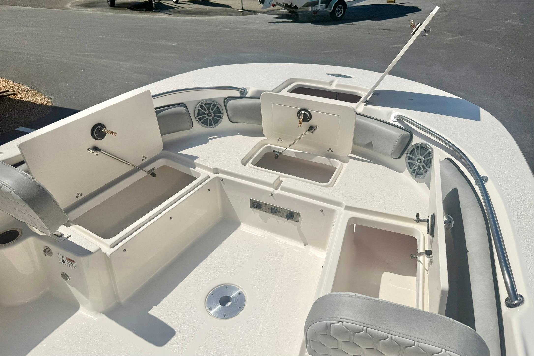2026 Carolina Skiff 21 Ultra Elite boat interior with open storage compartments.