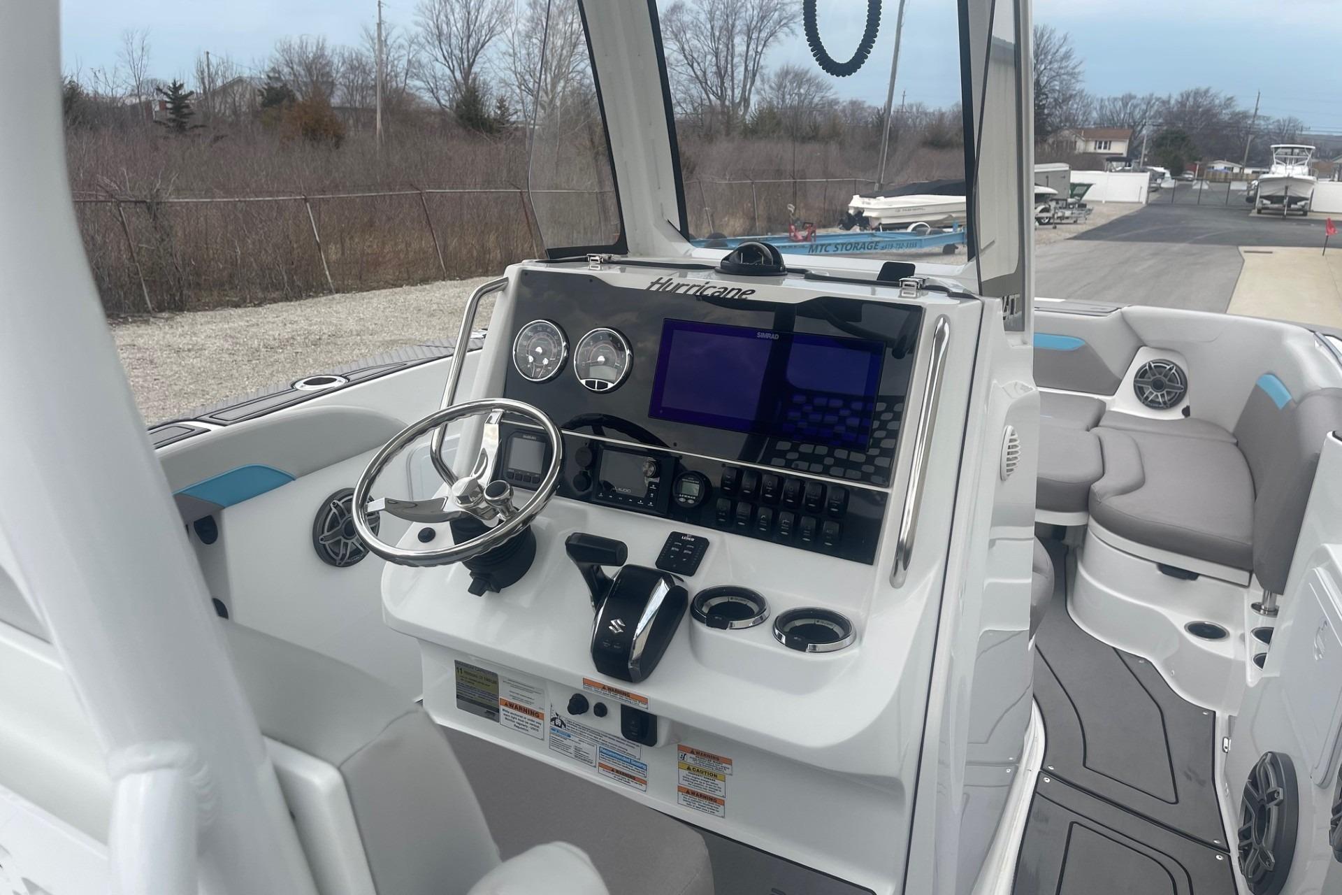 2025 Hurricane Center Console 24 OB boat interior with modern dashboard and seating.