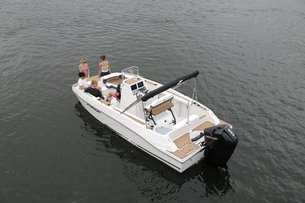 2025 Starcraft SVX 211 OB CC boat on water with passengers enjoying a ride.