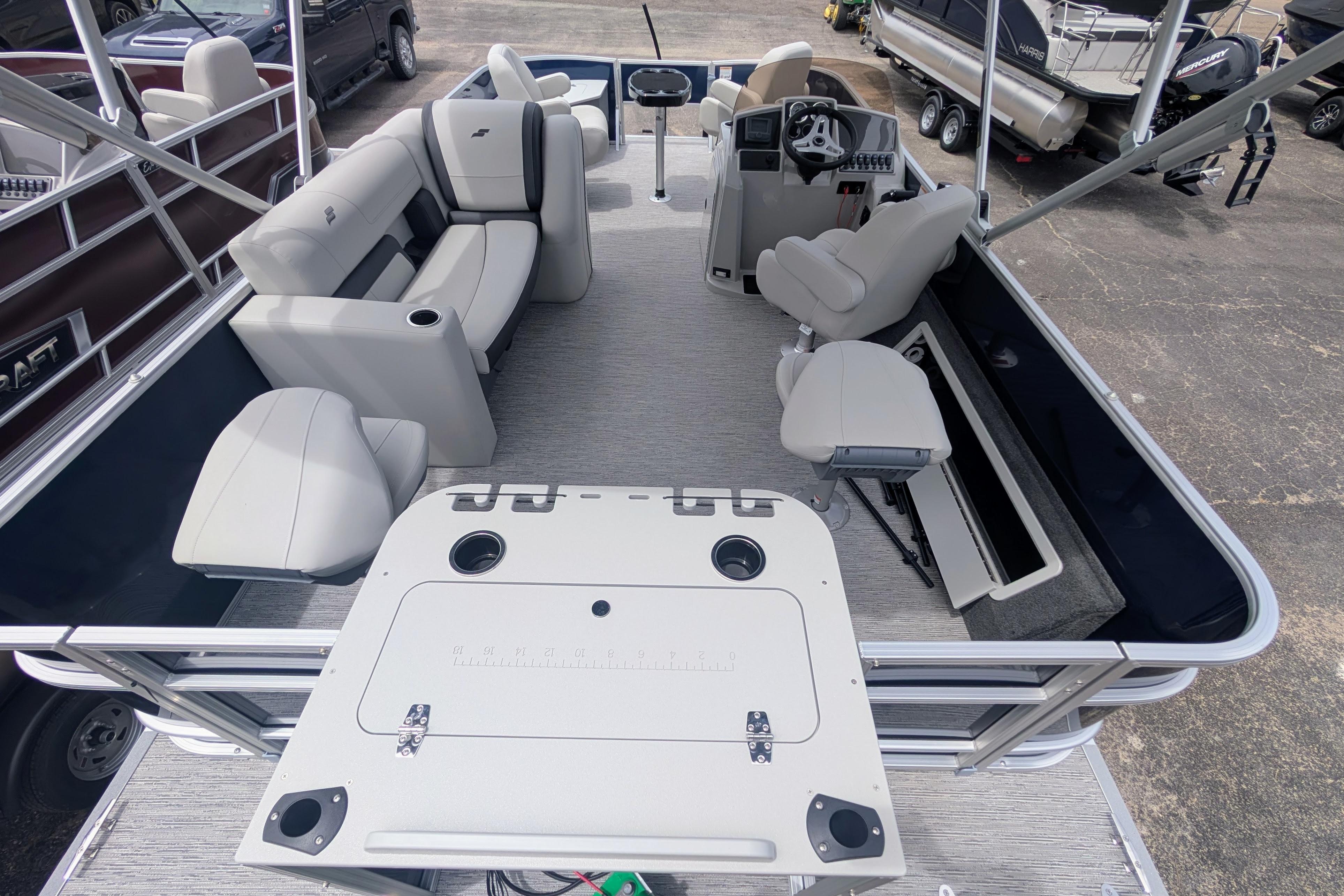 2026 Starcraft EX 20 F pontoon boat interior with seating and helm station.