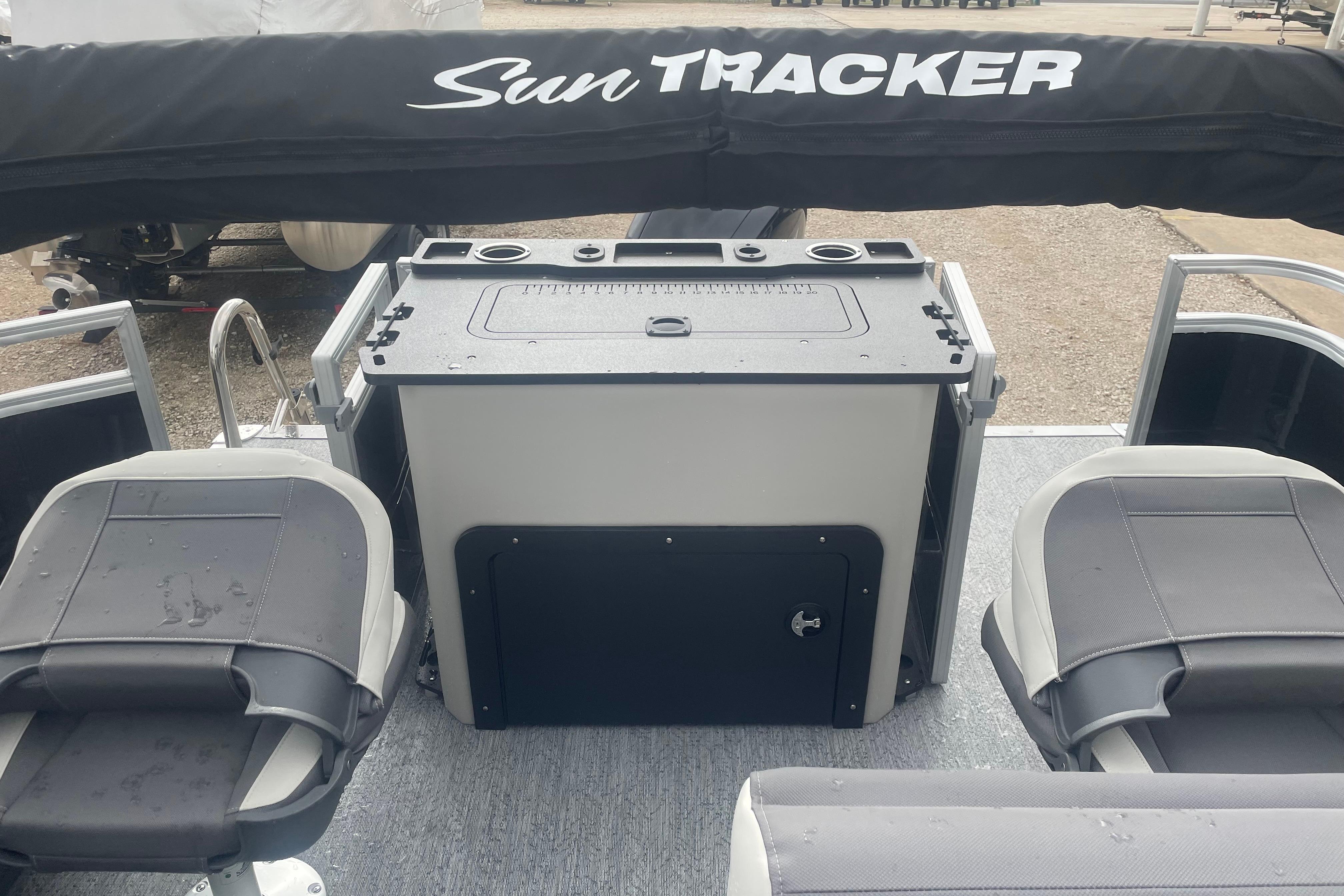 2026 Sun Tracker Fishin' Barge 22 XP3 interior with seating and storage.
