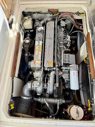 Engine compartment of a 1978 Dyer 29 Trunk Cabin boat, showcasing detailed mechanical components.