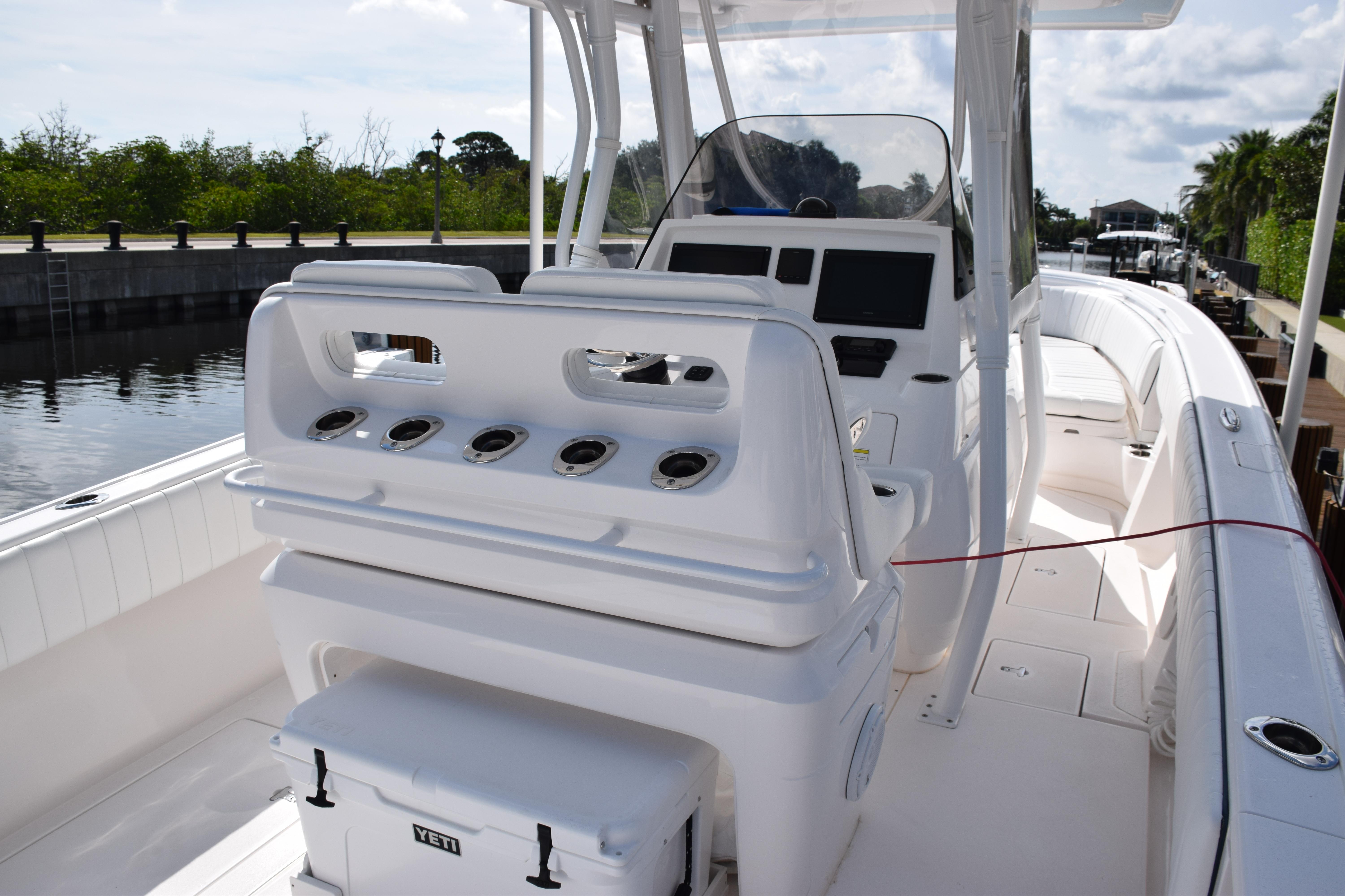 2017 Intrepid 327 boat interior with helm station and seating.