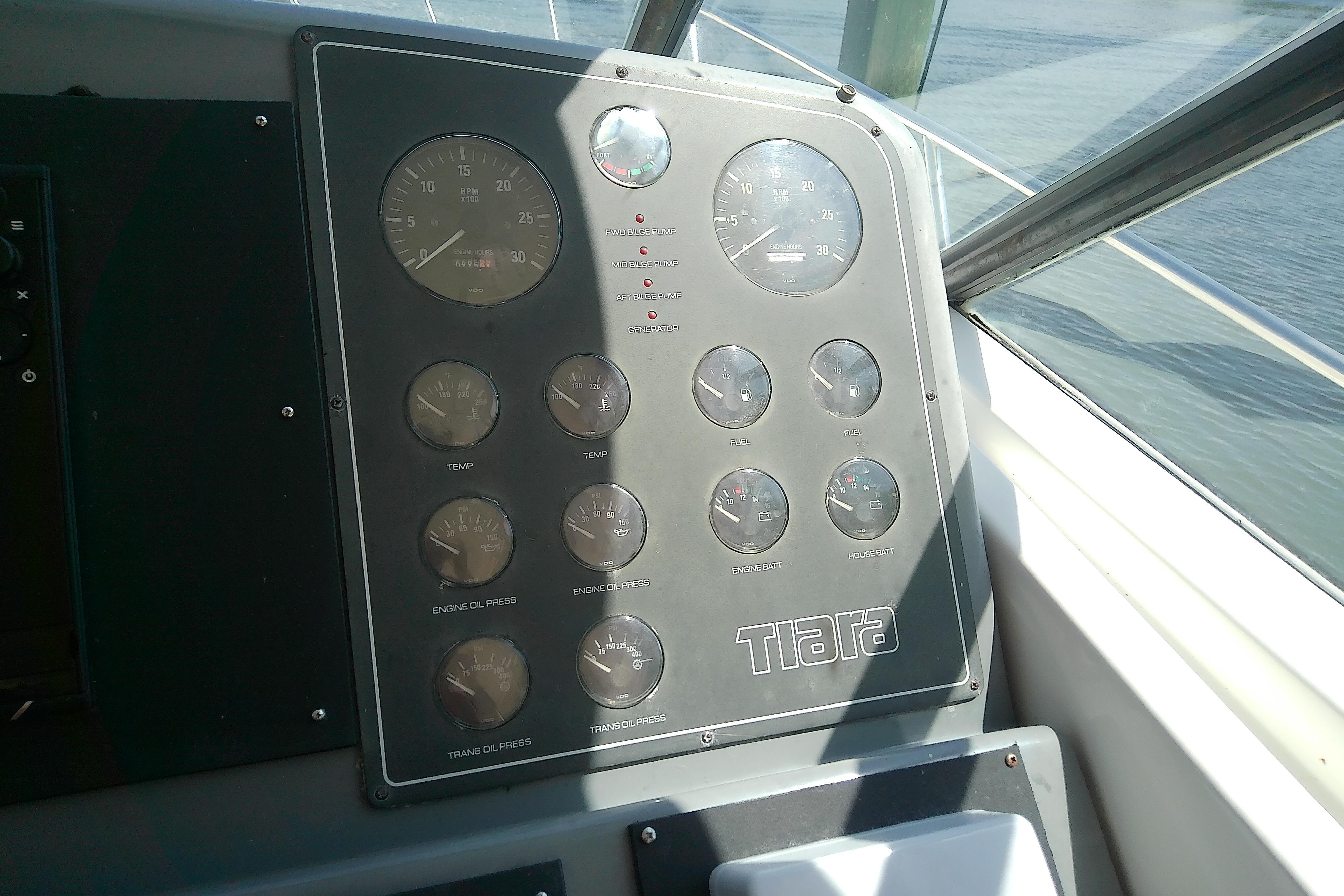 Instrument panel of a 2000 Tiara Yachts 4100 Open, featuring various gauges and controls.