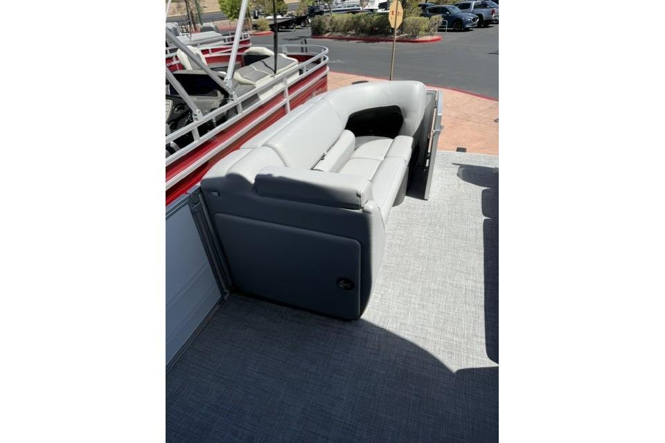 2026 Sun Tracker Party Barge 20 DLX with gray seating on deck.