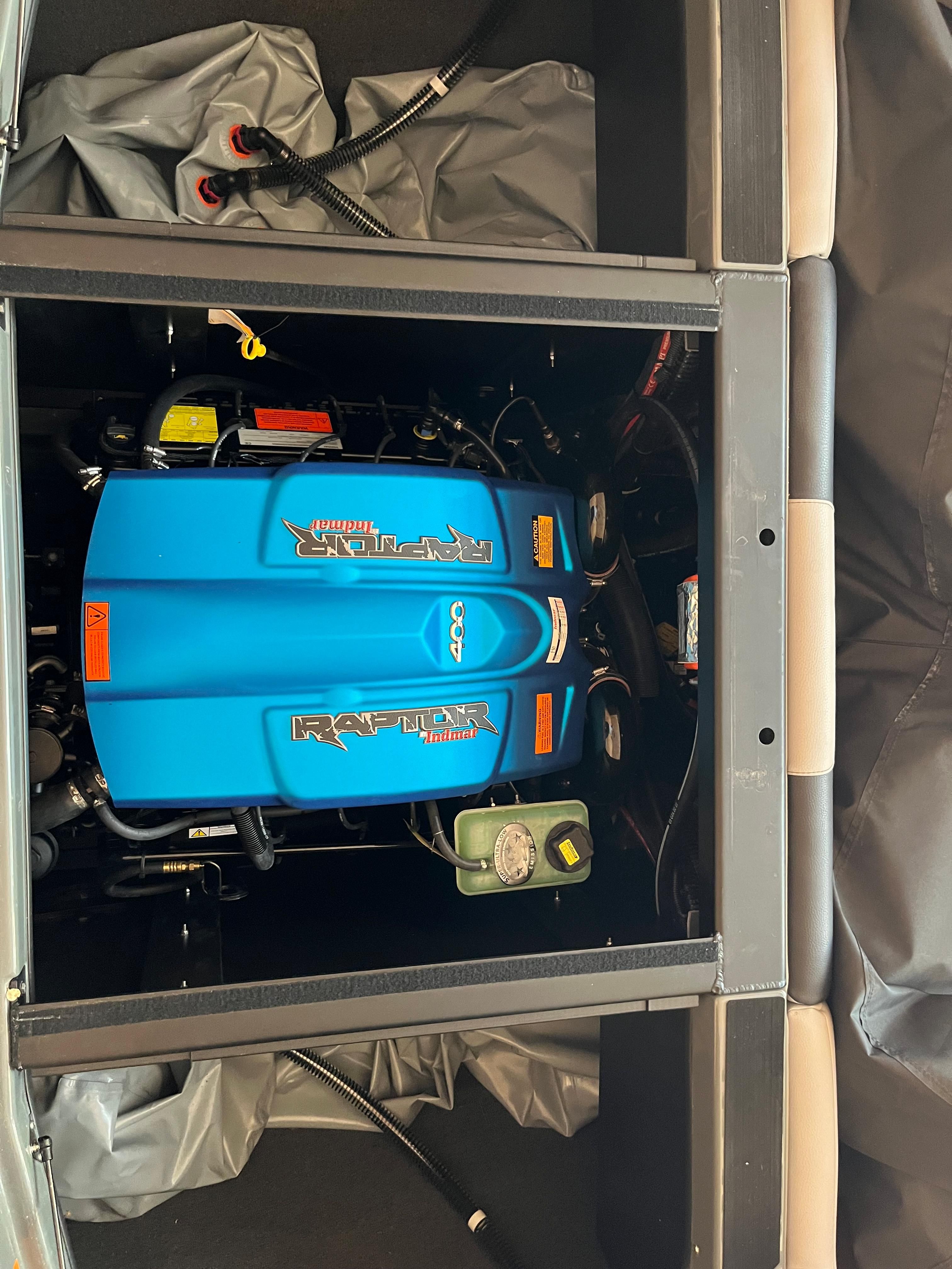 The engine compartment of a 2022 ATX Surf Boats 22 Type-S featuring a Raptor engine.