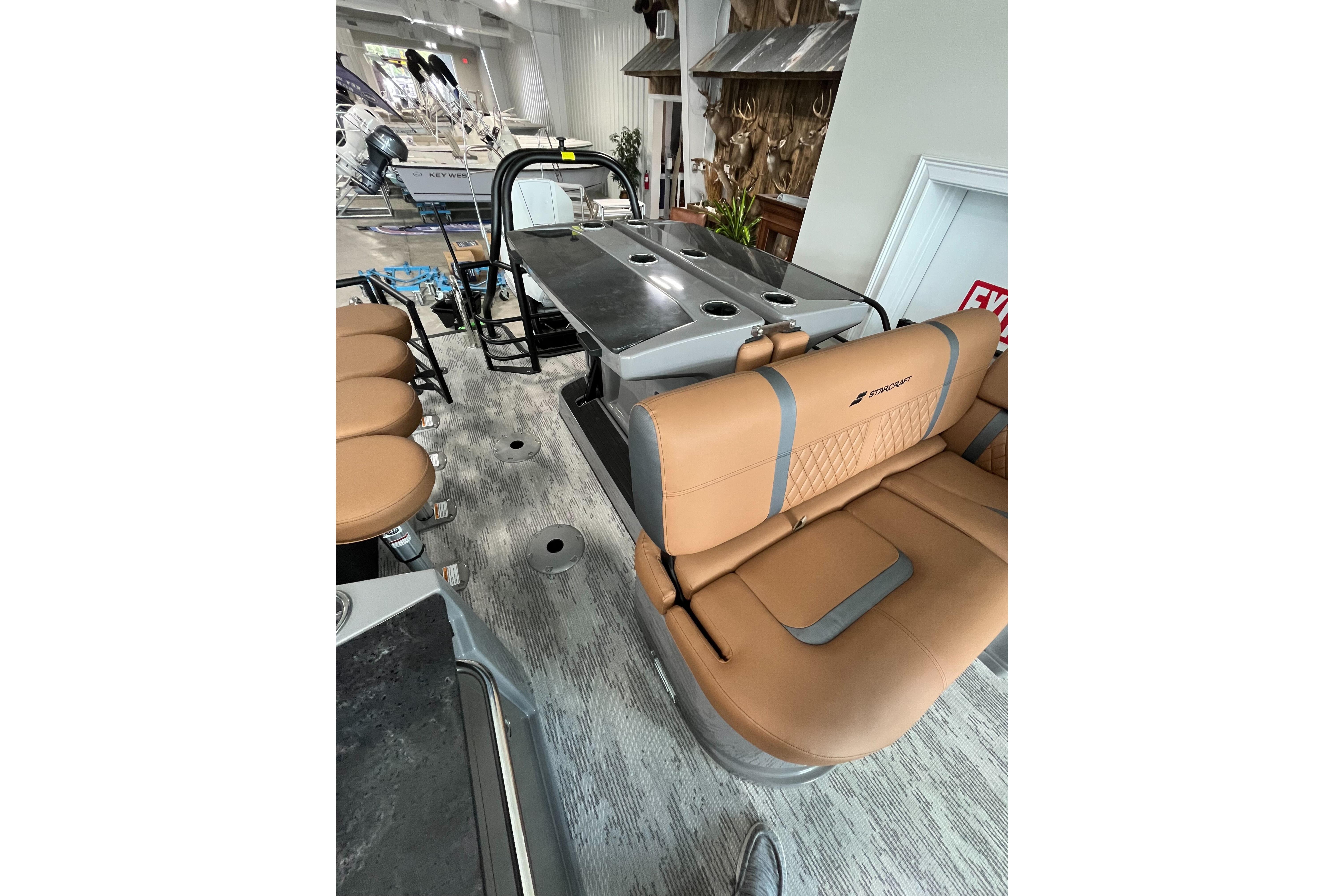 2026 Starcraft RX 25 DL DC boat interior with tan seating and modern design.