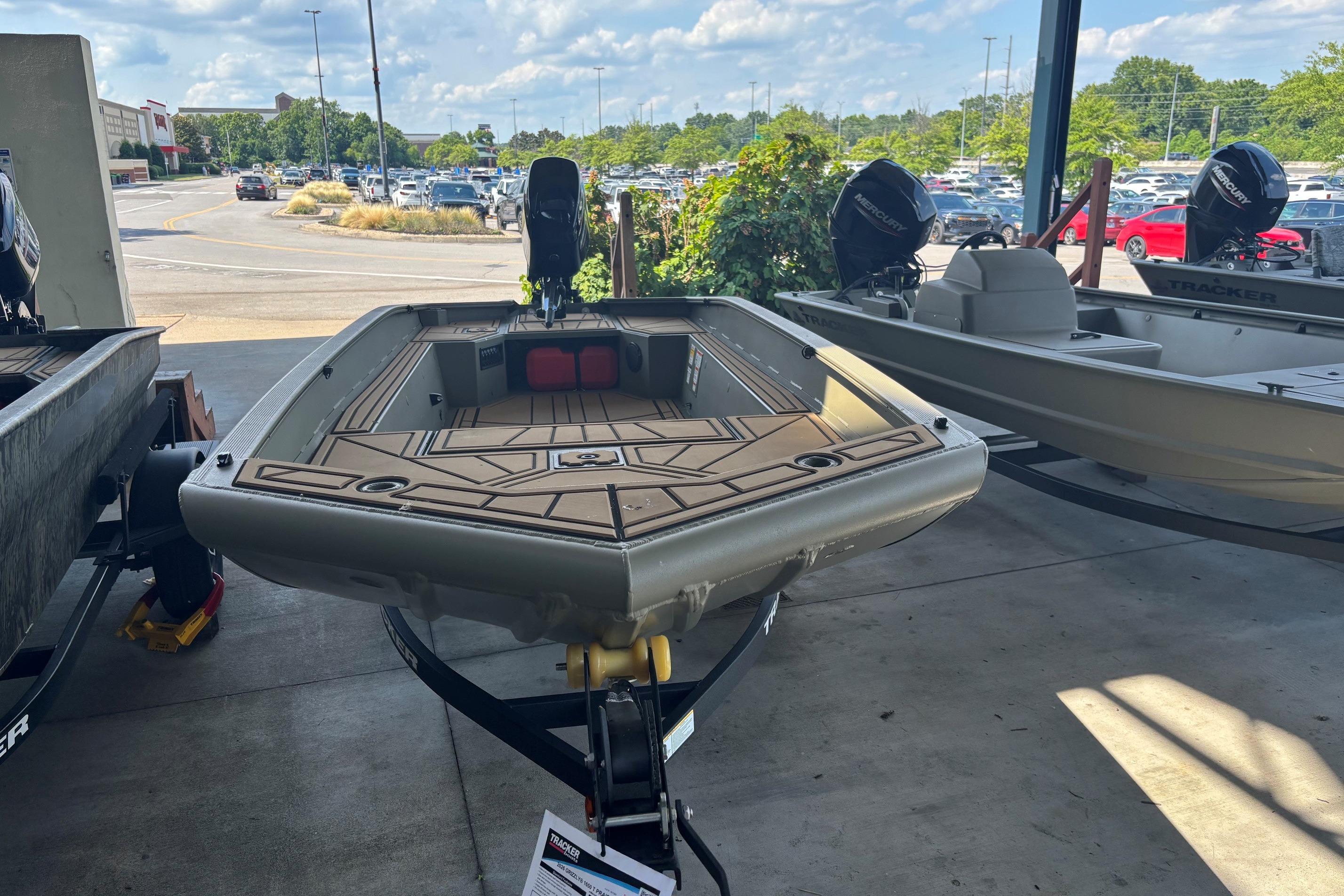 2026 Tracker Grizzly 1650 T Prairie Wings Edition boat displayed outdoors.