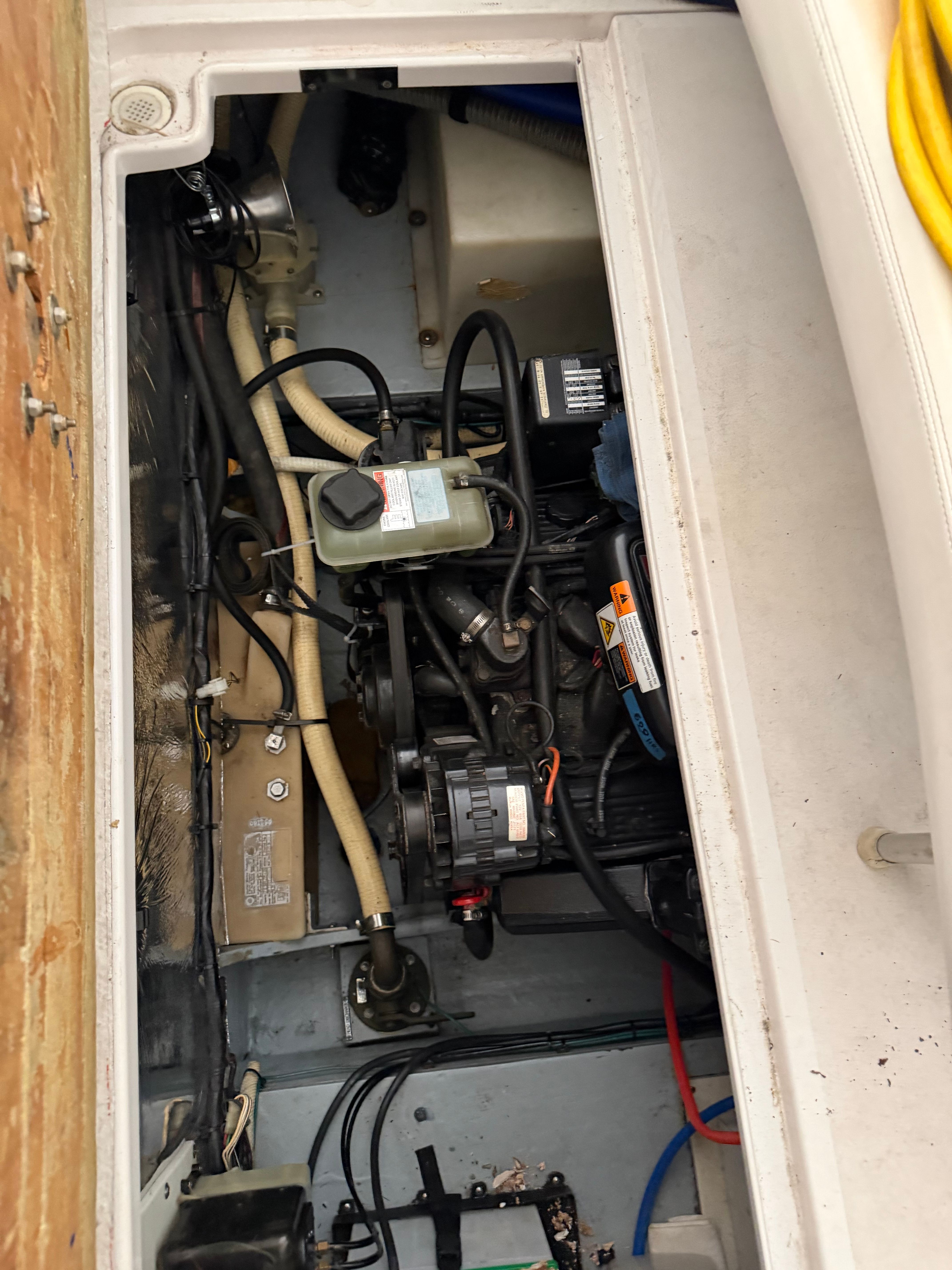 Engine compartment of a 1990 Four Winns Vista boat.