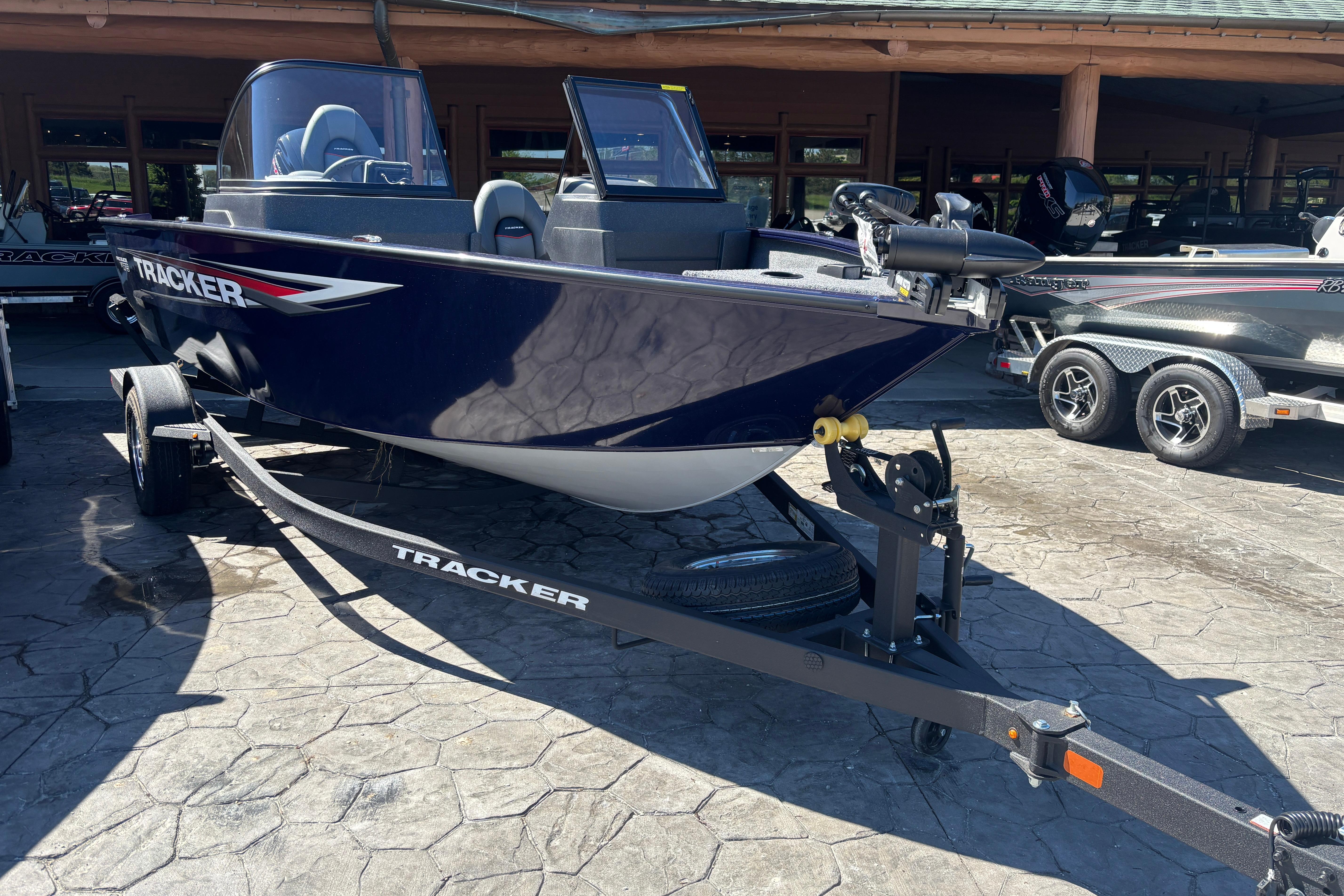 2026 Tracker Pro Guide V-175 WT boat on trailer in showroom.