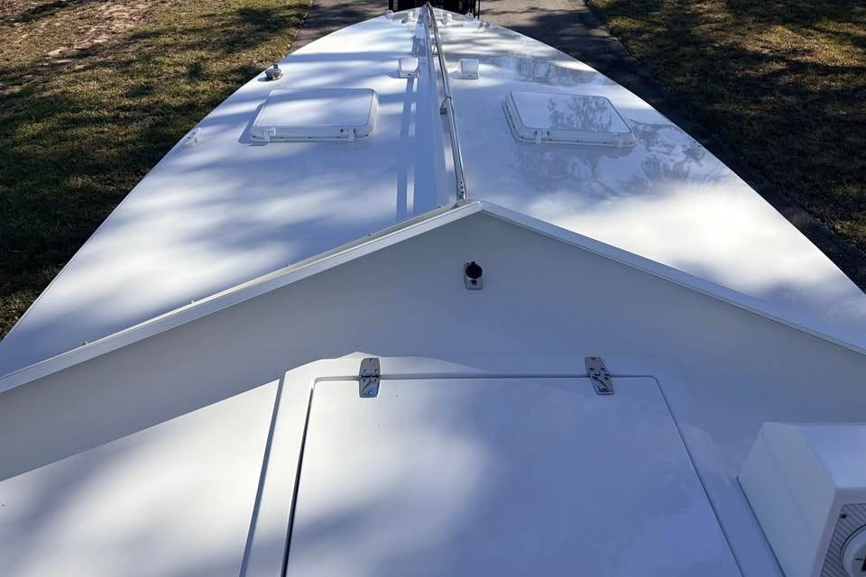 1983 Cigarette 24' Classic boat deck, white surface, outdoor setting.