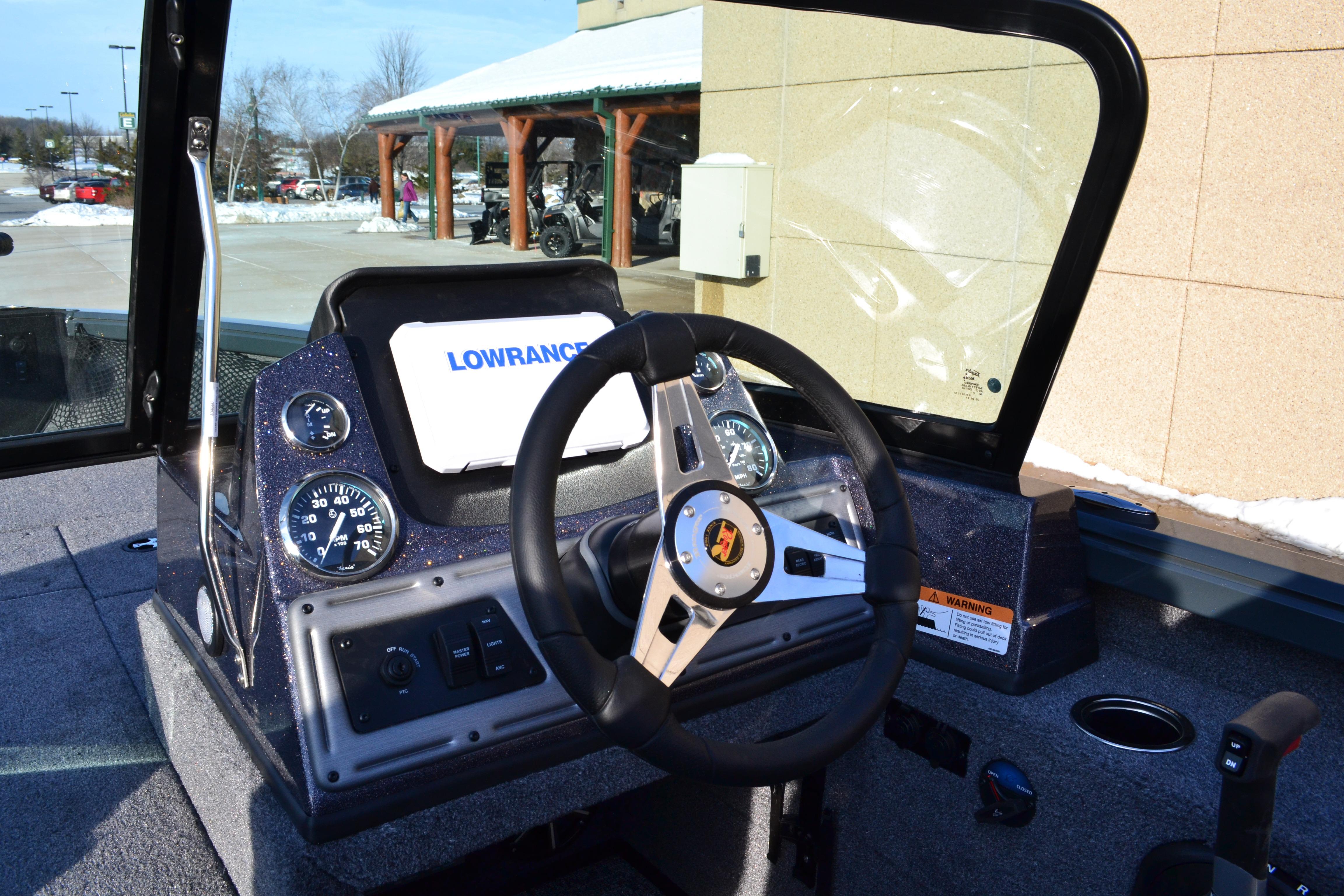 2026 Ranger VS1882SC Reata boat dashboard with steering wheel and Lowrance display.