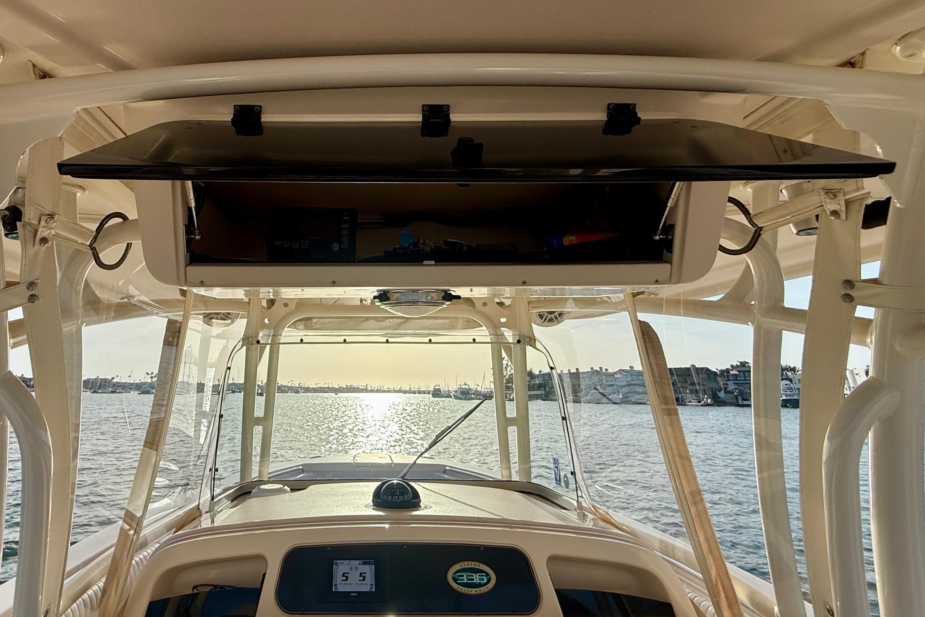 Interior view of 2012 Grady-White Canyon 336 boat, overlooking a scenic waterfront.