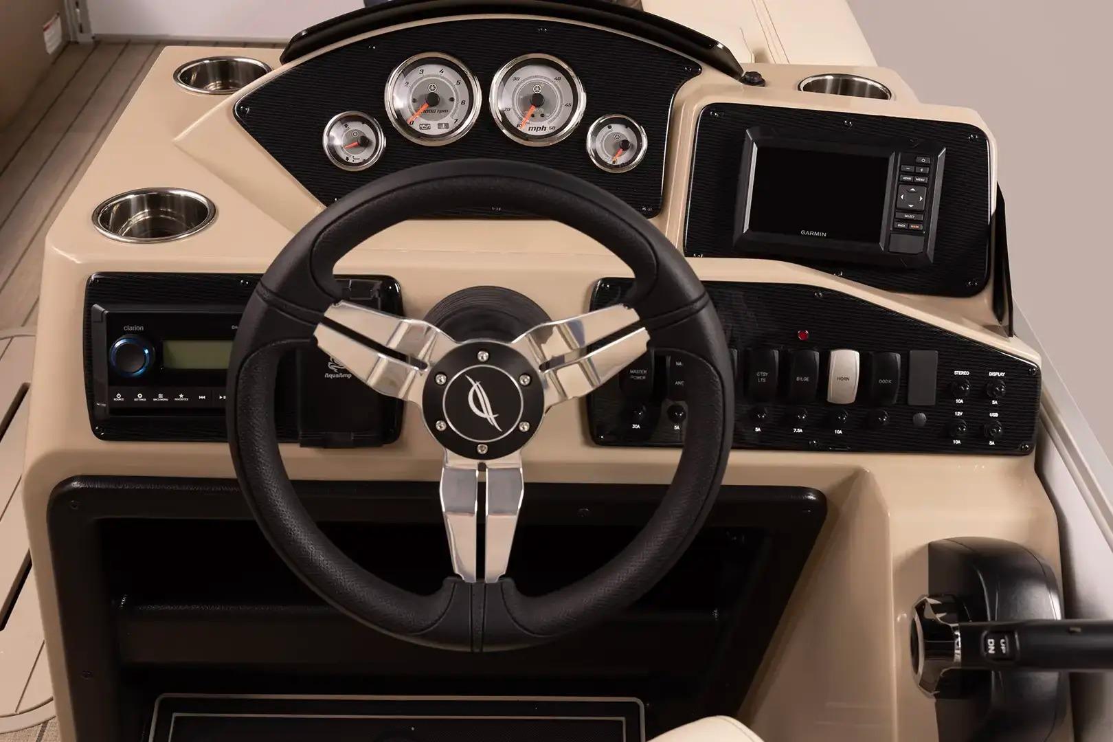 Manufacturer Provided Image: 2026 SunCatcher Select 322RC boat dashboard with steering wheel and control panel.