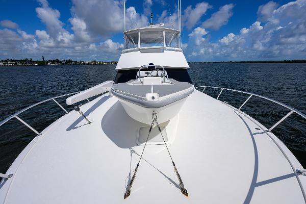Viking 50 Convertible yacht, 2000 model, cruising on calm waters under a blue sky.