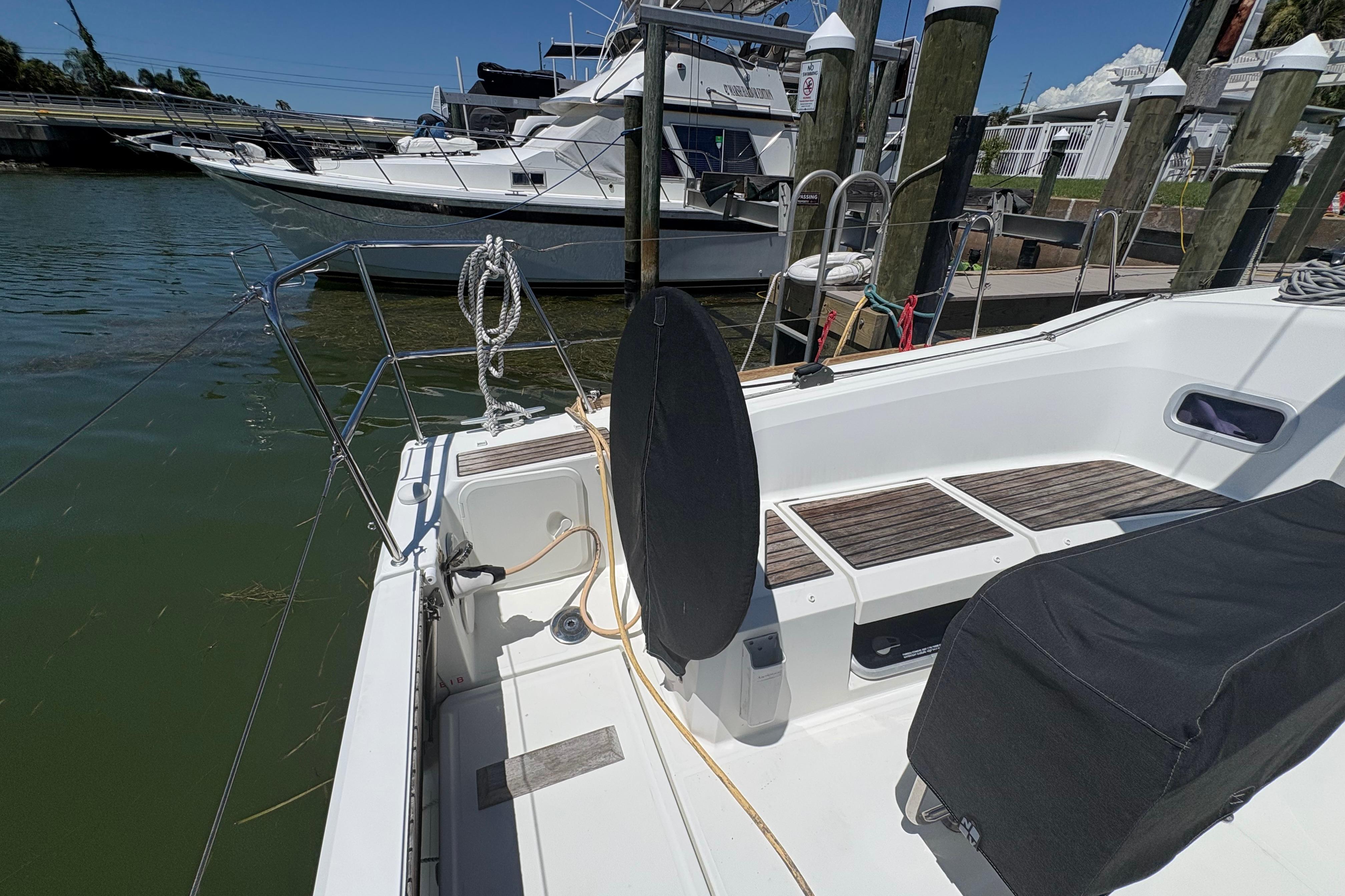 Jeanneau Sun Odyssey 349 (2021) docked, showcasing sleek deck design and marina setting.