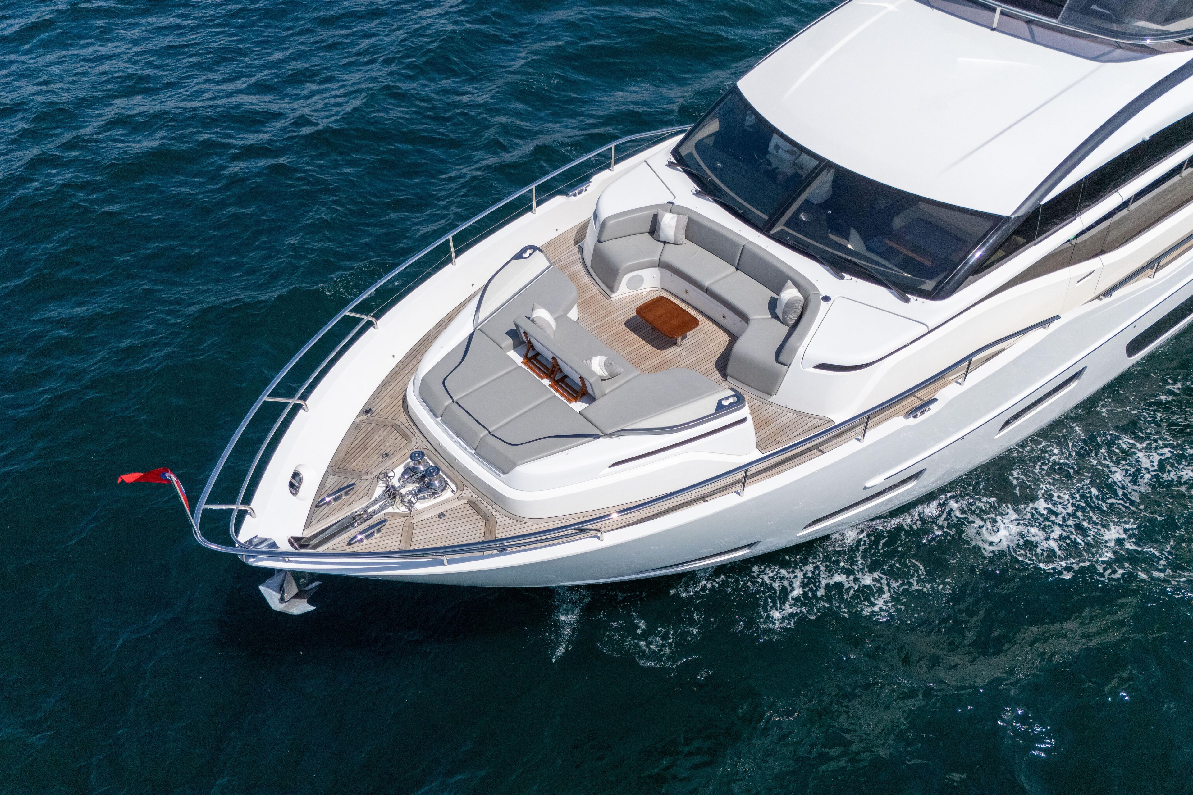 Luxurious 2020 Princess Y85 yacht cruising on open water, featuring elegant deck seating.