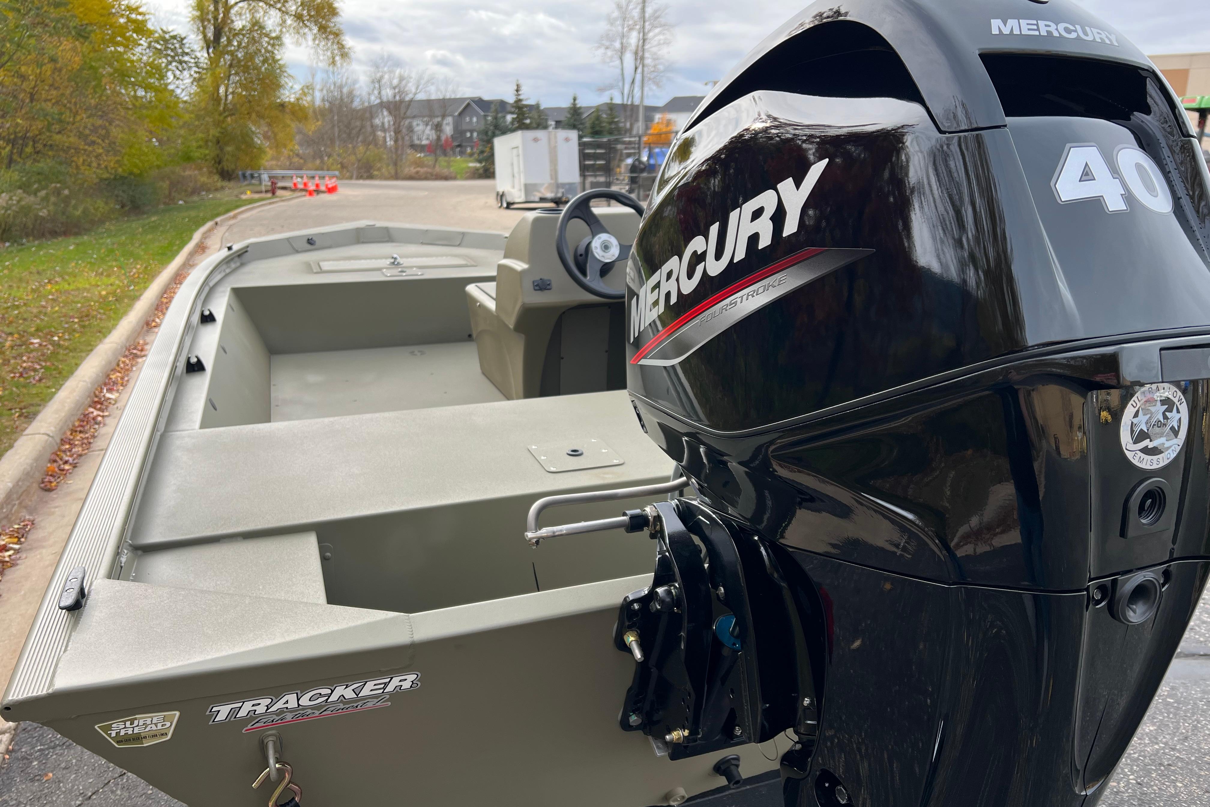 2026 Tracker Grizzly 1648 SC boat with Mercury 40 outboard motor, parked outdoors.