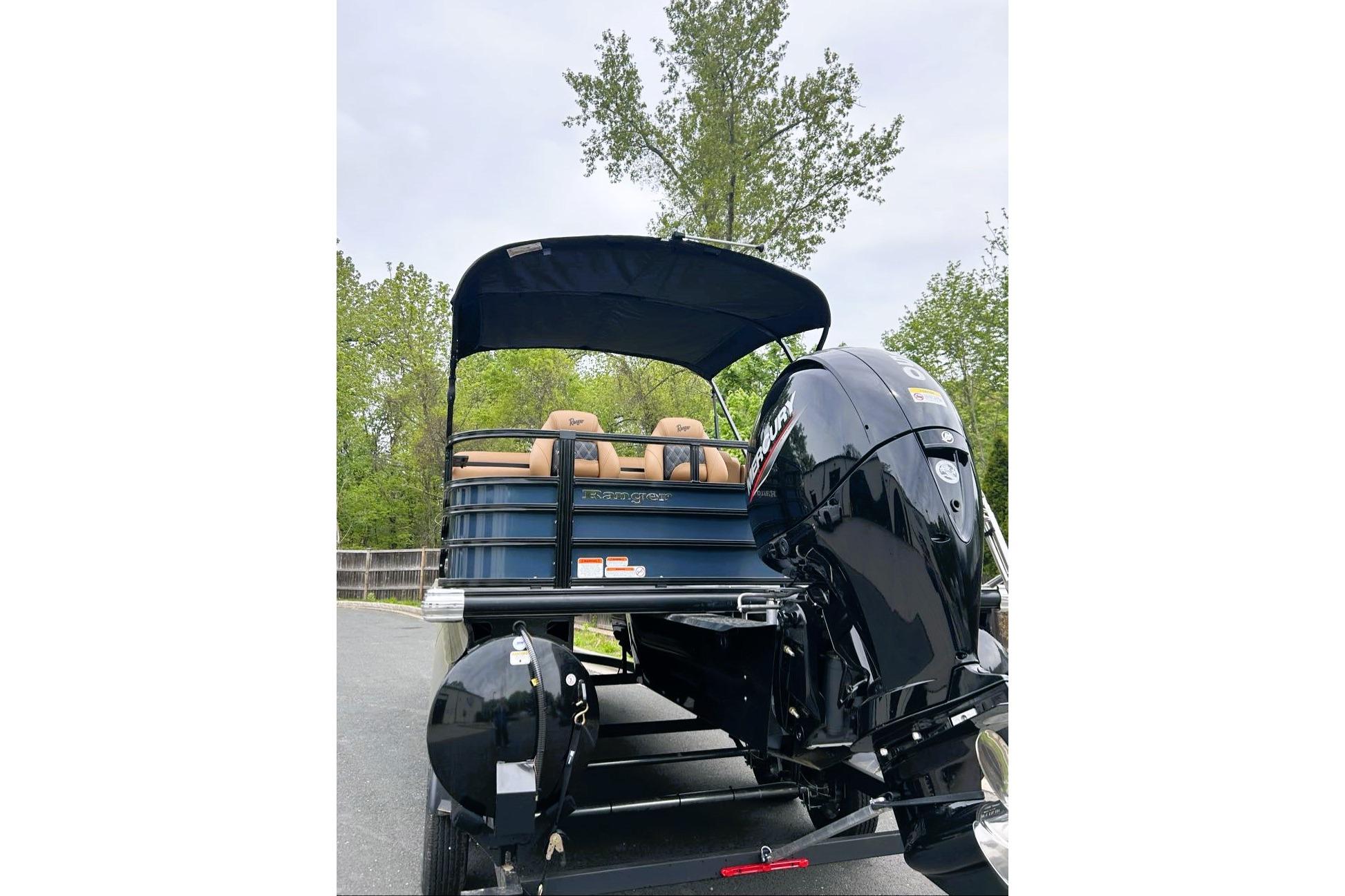 2026 Ranger 220FC boat with Mercury outboard motor, parked on a trailer.