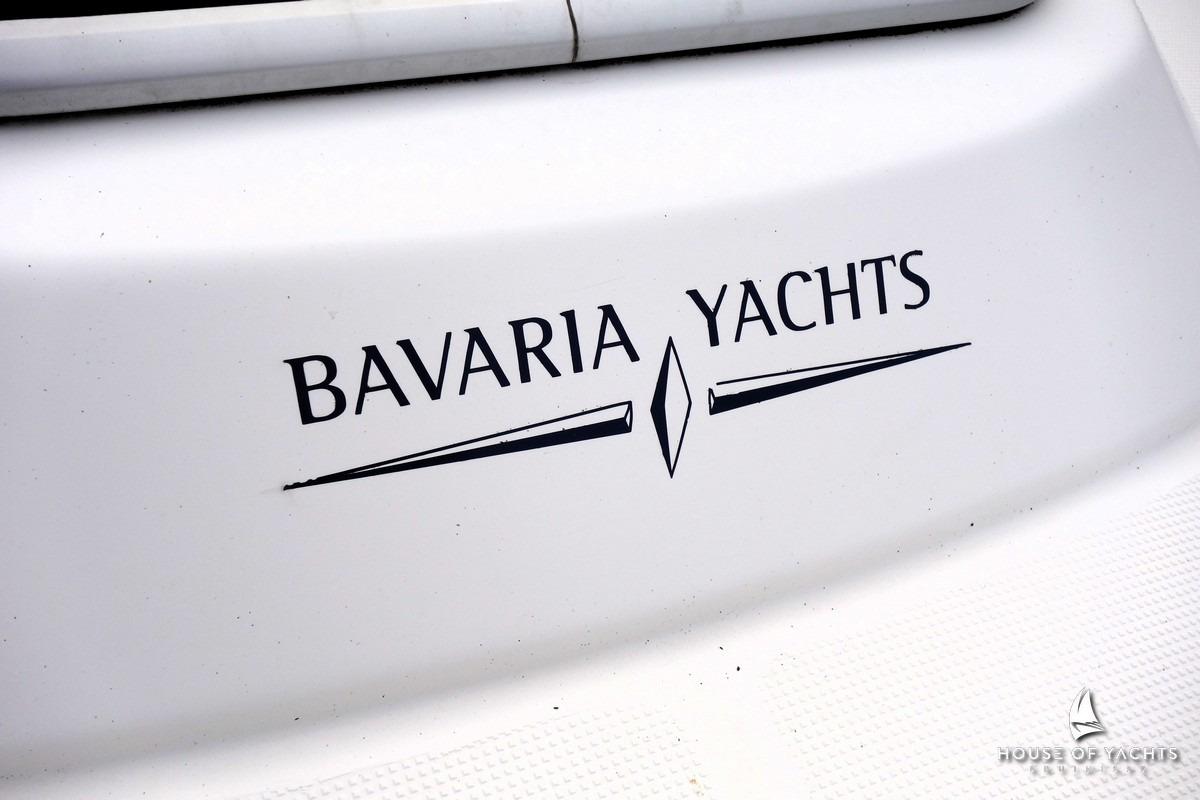 Bavaria Yachts logo on a 2003 Bavaria 32 sailboat, white background.