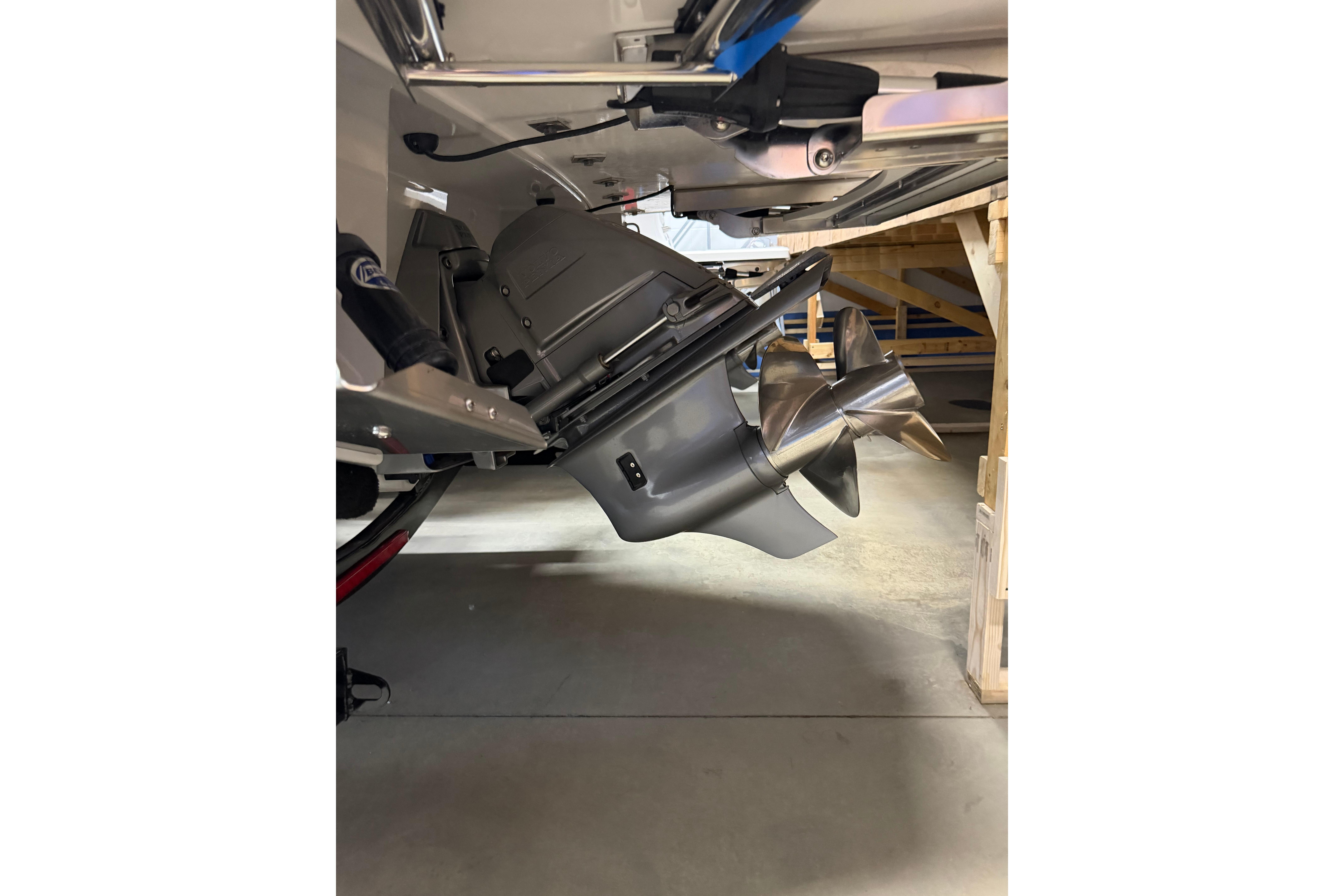 2026 Regal LS6 boat propeller and drive system in a garage setting.