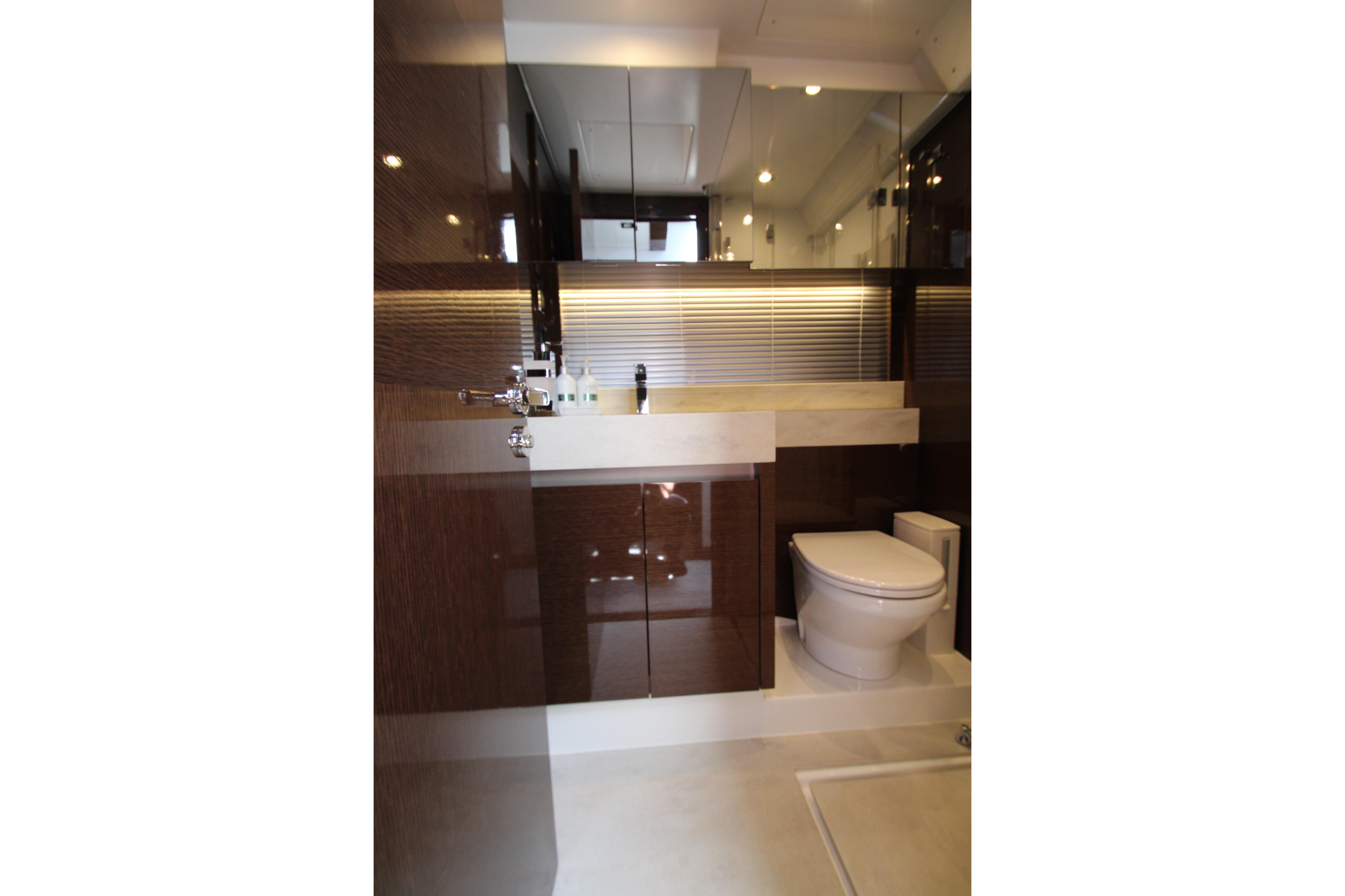 Luxurious bathroom interior of 2022 Prestige 520 yacht, featuring modern fixtures and elegant design.