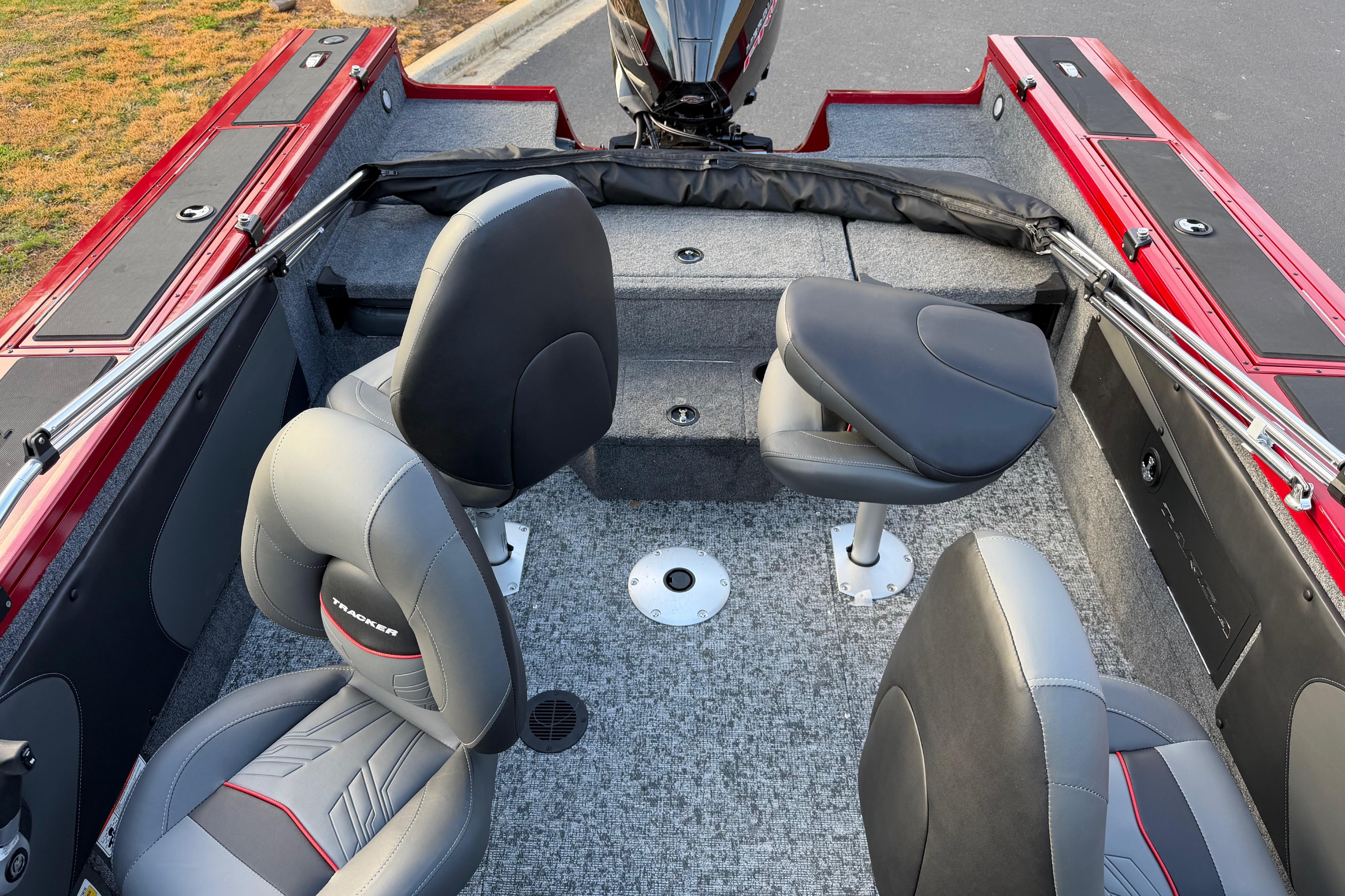 2026 Tracker Targa V-19 Combo boat interior with gray and red seating, carpeted floor.