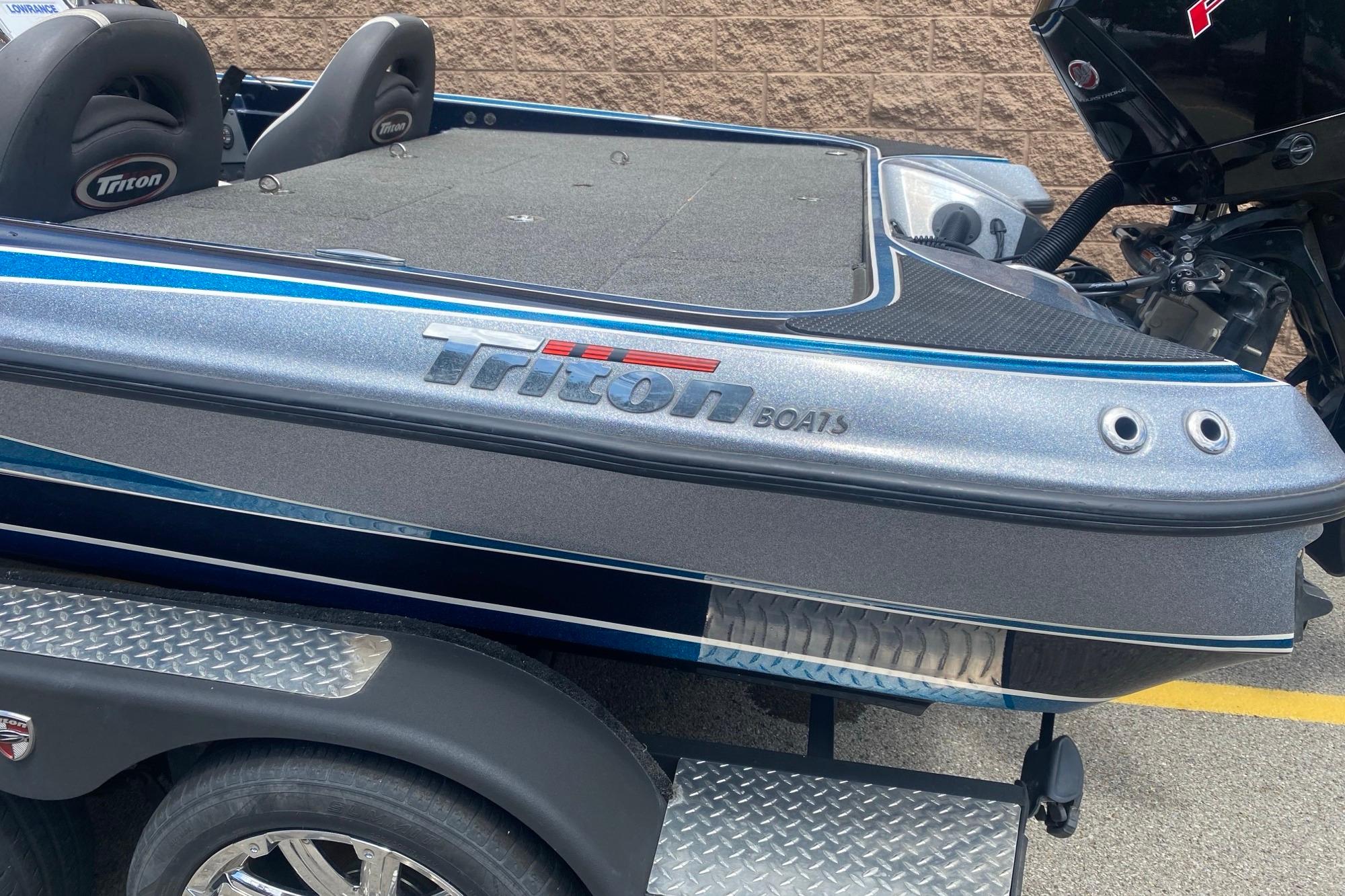 2020 Triton 20 TrX Patriot boat with sleek design and dual seats on a trailer.