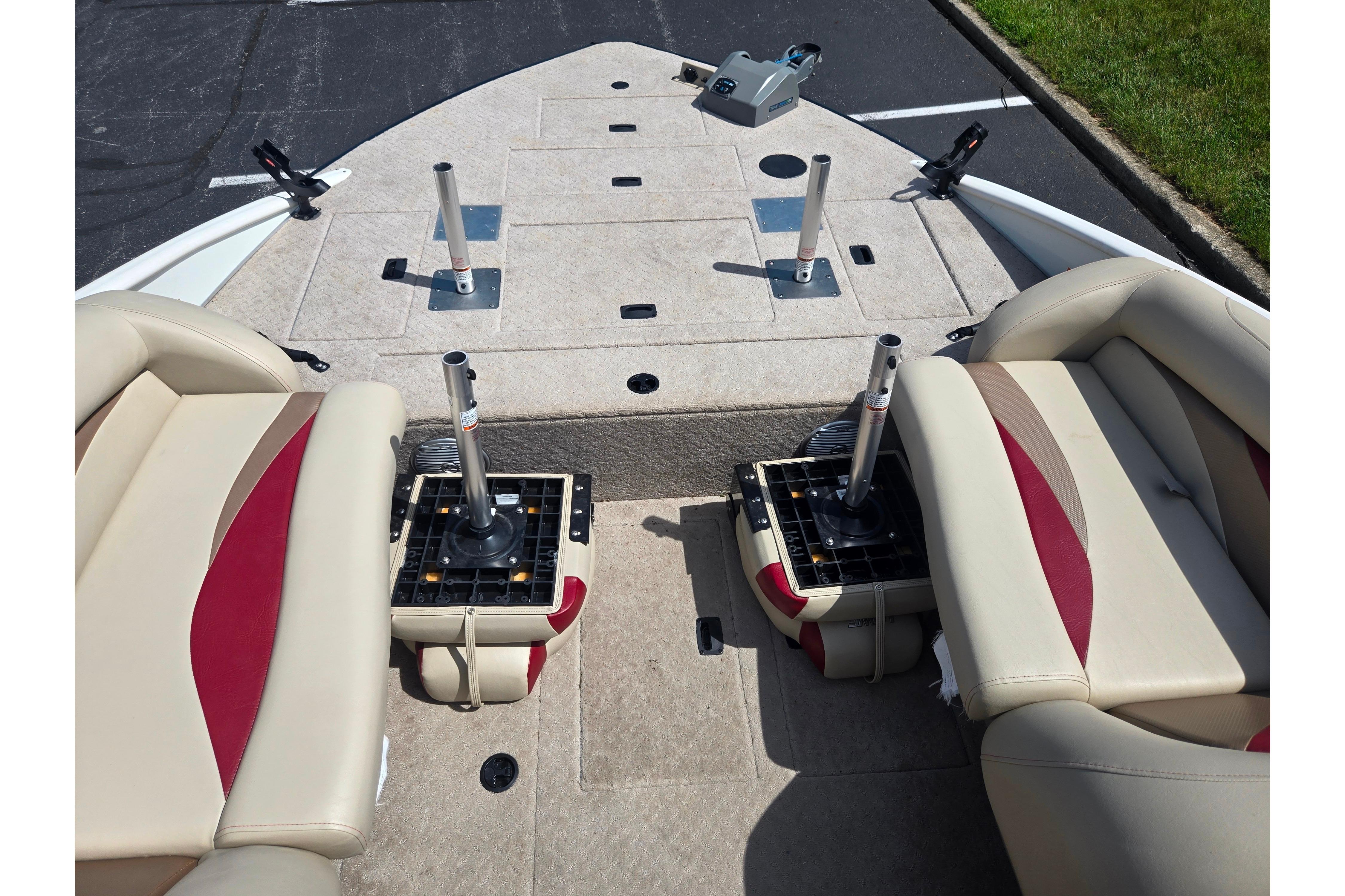 2015 Lowe Sport Deck 224 boat interior with beige and red seating.
