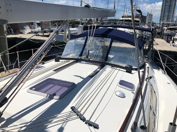 2001 Jeanneau 45.2 sailboat docked at marina, featuring deck and rigging details.