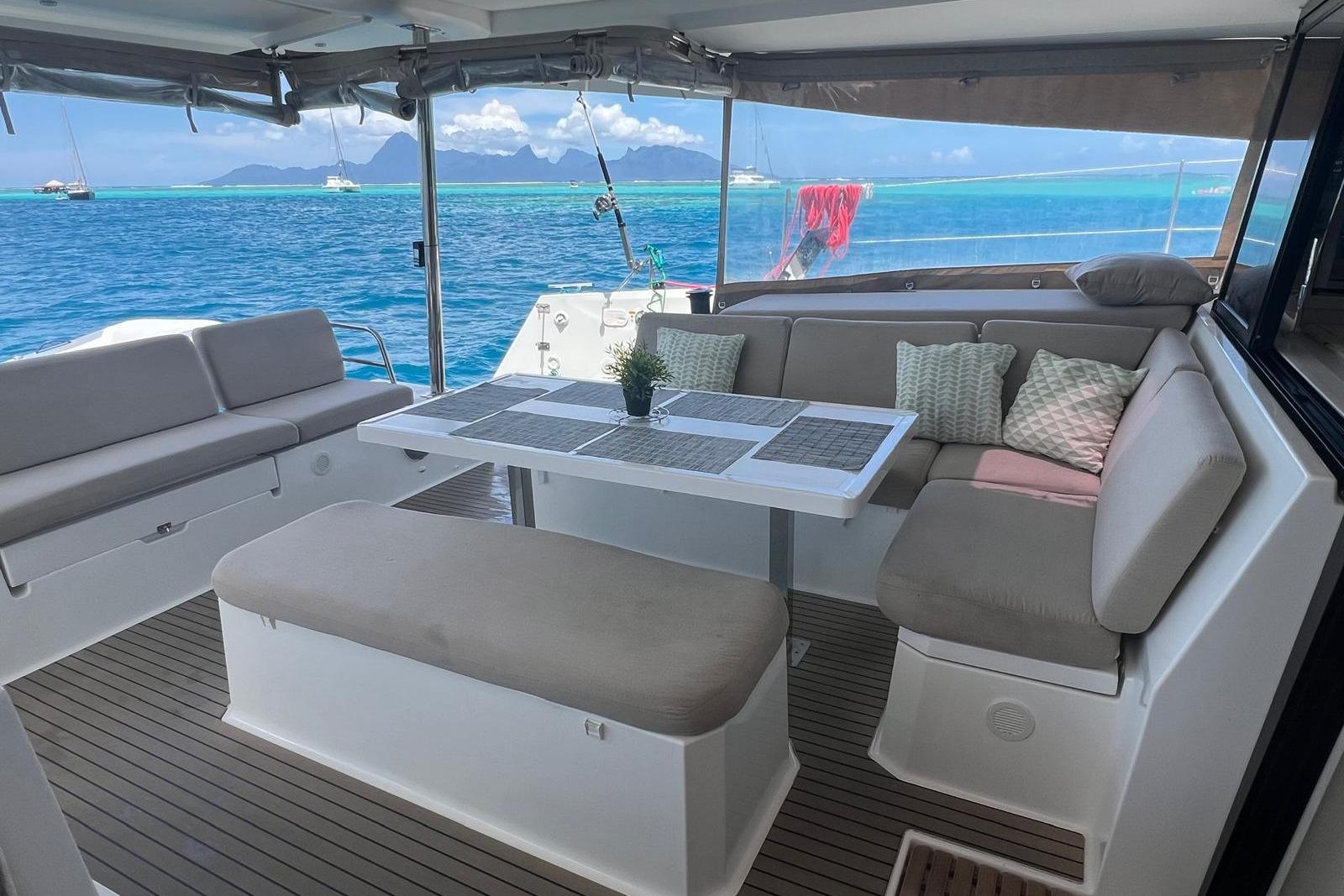 Luxurious 2022 Fountaine Pajot Elba 45 Catamaran interior with ocean view and comfortable seating.