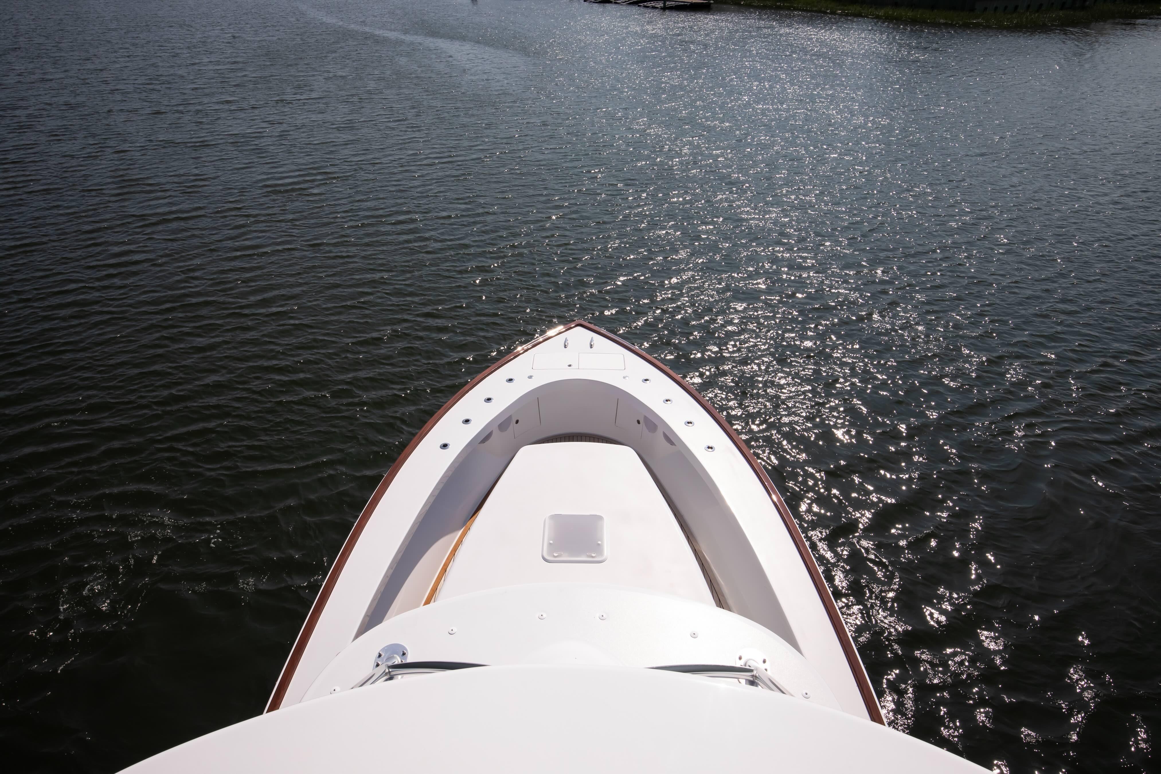 2026 Release Boatworks 46 Walkaround on shimmering water, viewed from above.